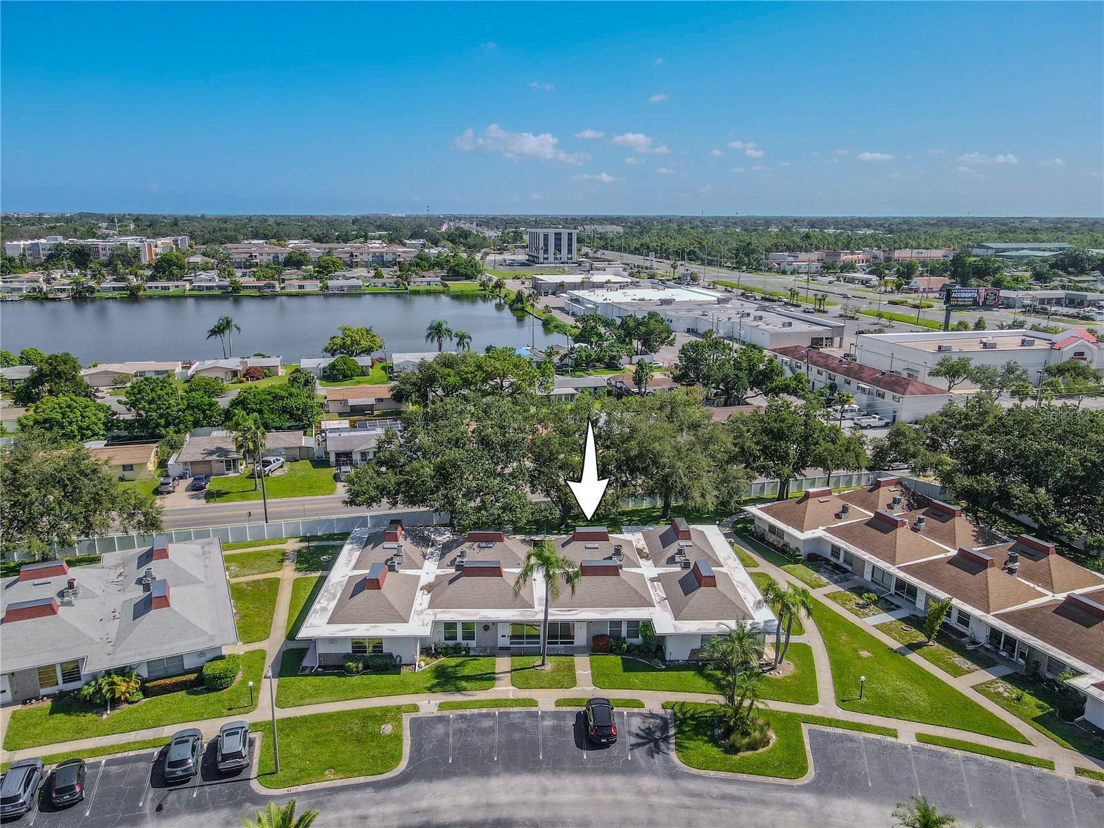 Tahitian Gardens is a well-kept, active 55+ community with plenty of amenities including a heated pool, shuffleboard, walking paths around a scenic lake, and a wide variety of clubs and social events—from arts & crafts to card games. Just 3.8 miles to Fred Howard Park and the Gulf beaches of Tarpon Springs, and within walking distance to CVS, Walgreens, Aldi, and public transit. Tampa and Clearwater airports are under an hour away.