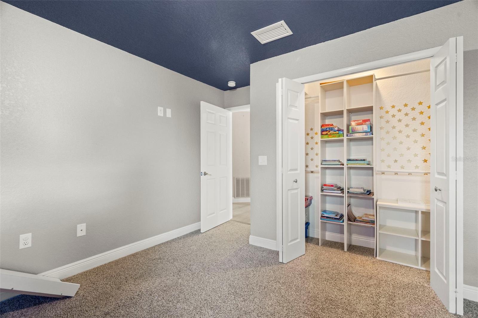 Sumptuous bedroom with French doors to balcony and large reach-in closet
