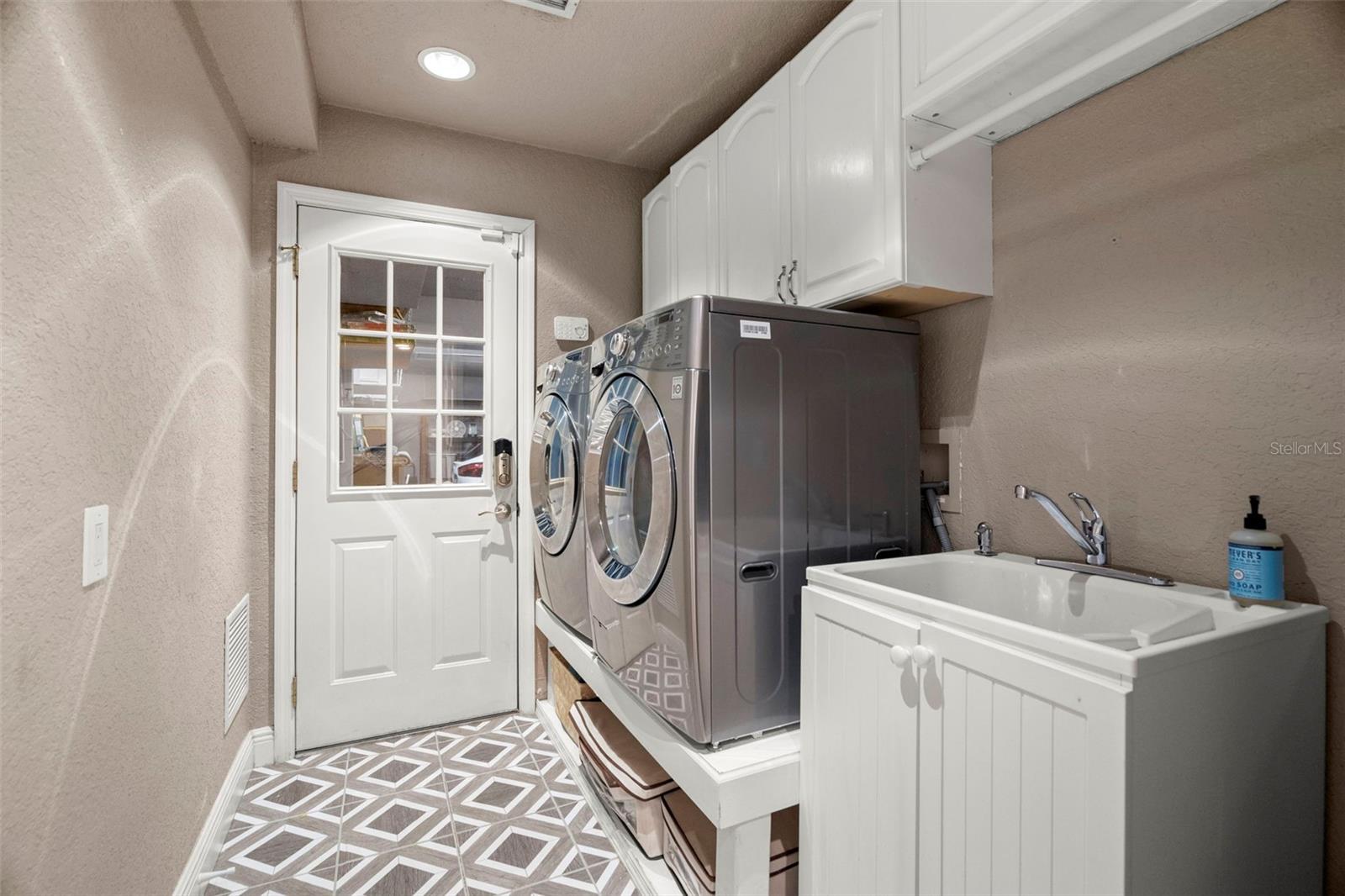 Laundry room with front load washer and dryer