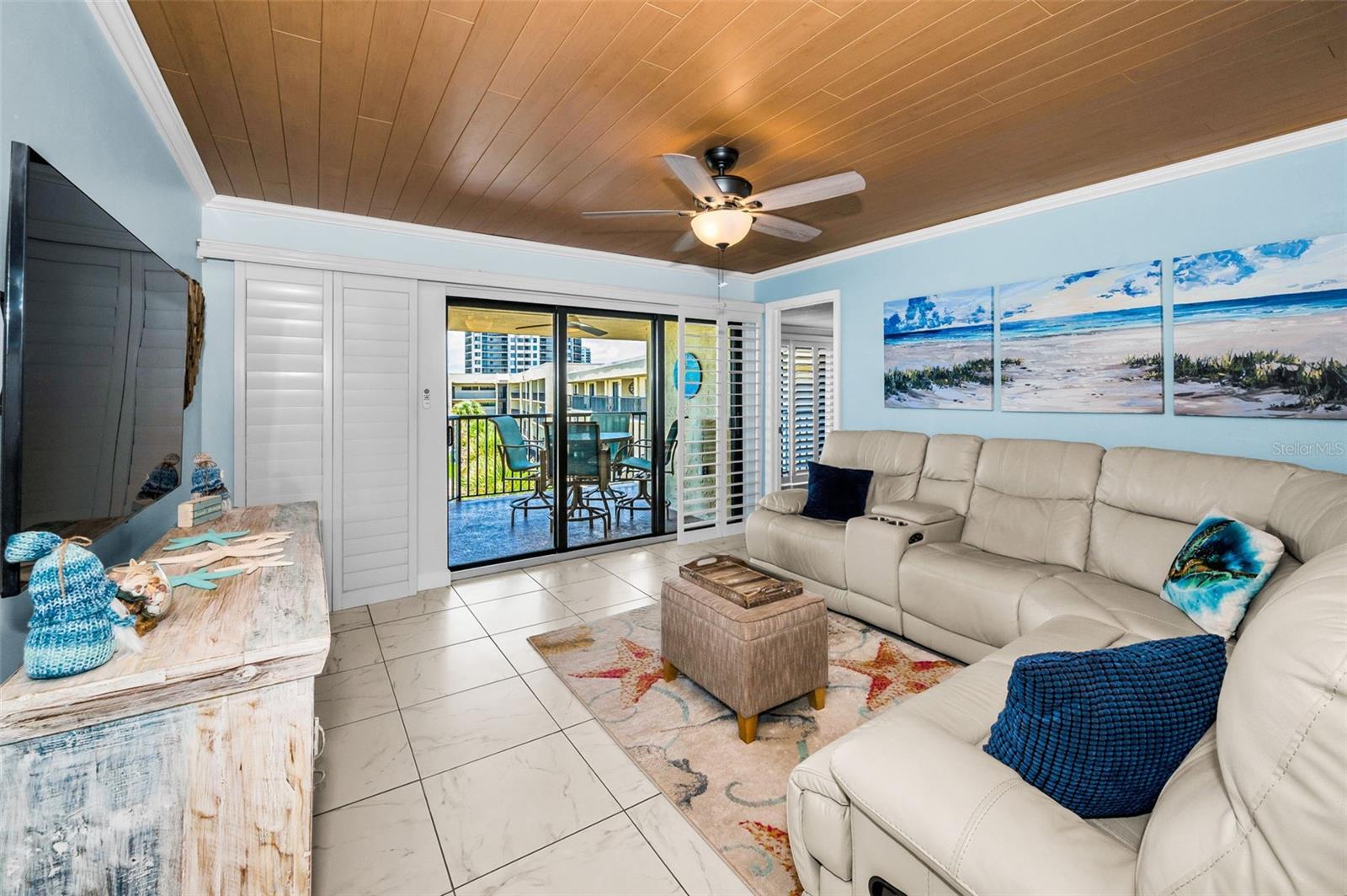 Where the indoors meet the shore—your living room frames the horizon and flows into breezy balcony bliss
