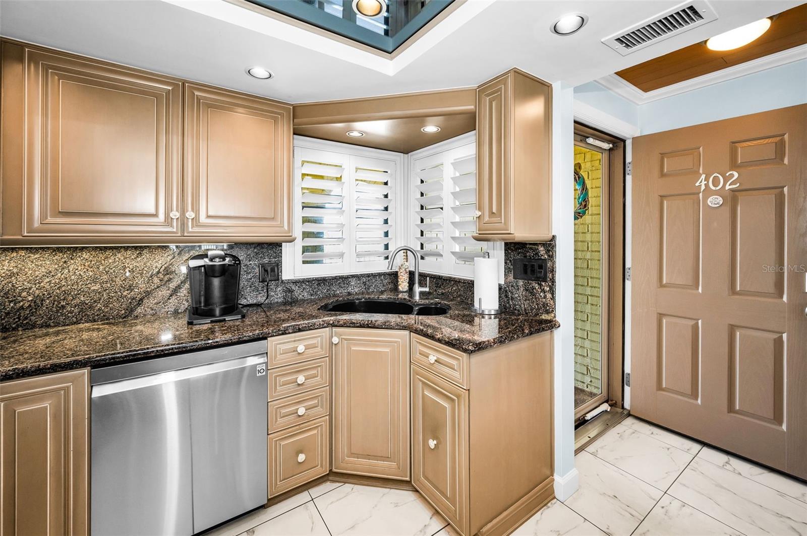 Flooded with natural light and outfitted with modern upgrades, this kitchen shines in every sense.