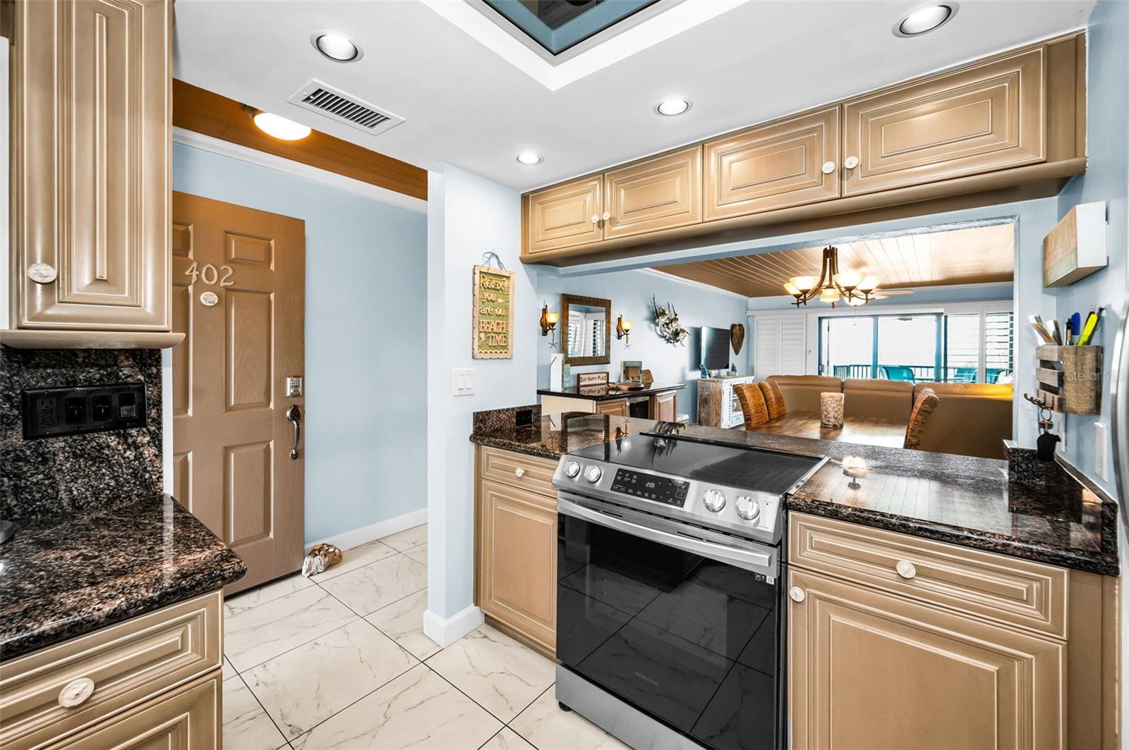 From quartz counters to contemporary cabinetry, this light-filled kitchen is thoughtfully updated and move-in ready
