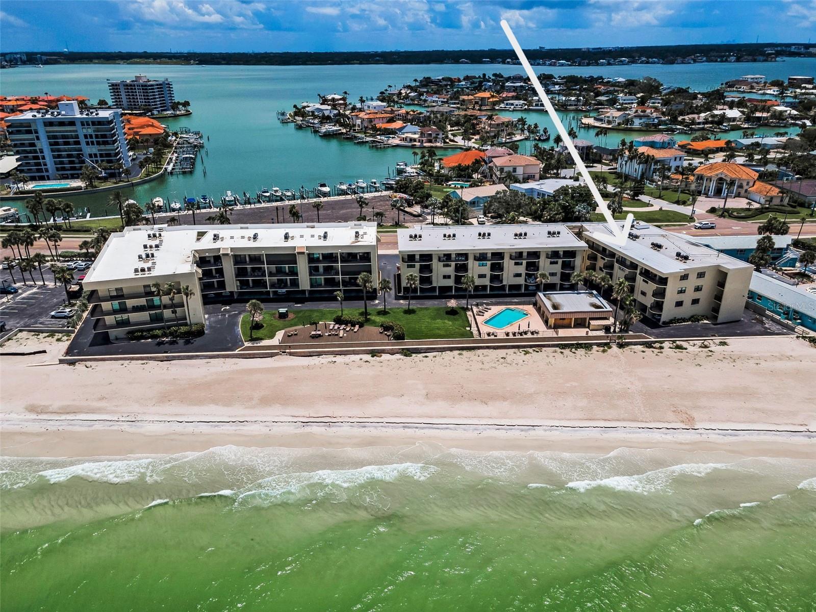 Panoramic proof that life’s better by the water—private paths, sun-kissed balconies, and the sand just steps away.