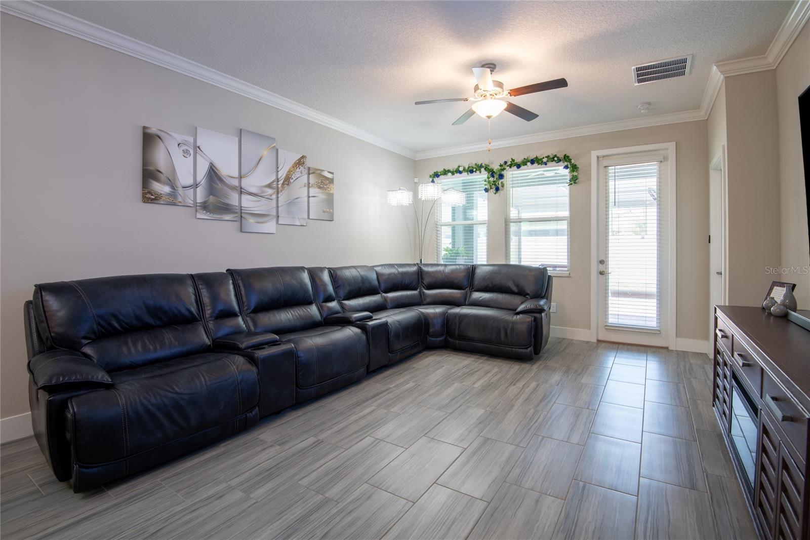 Large family room that leads out to extended screen patio.
