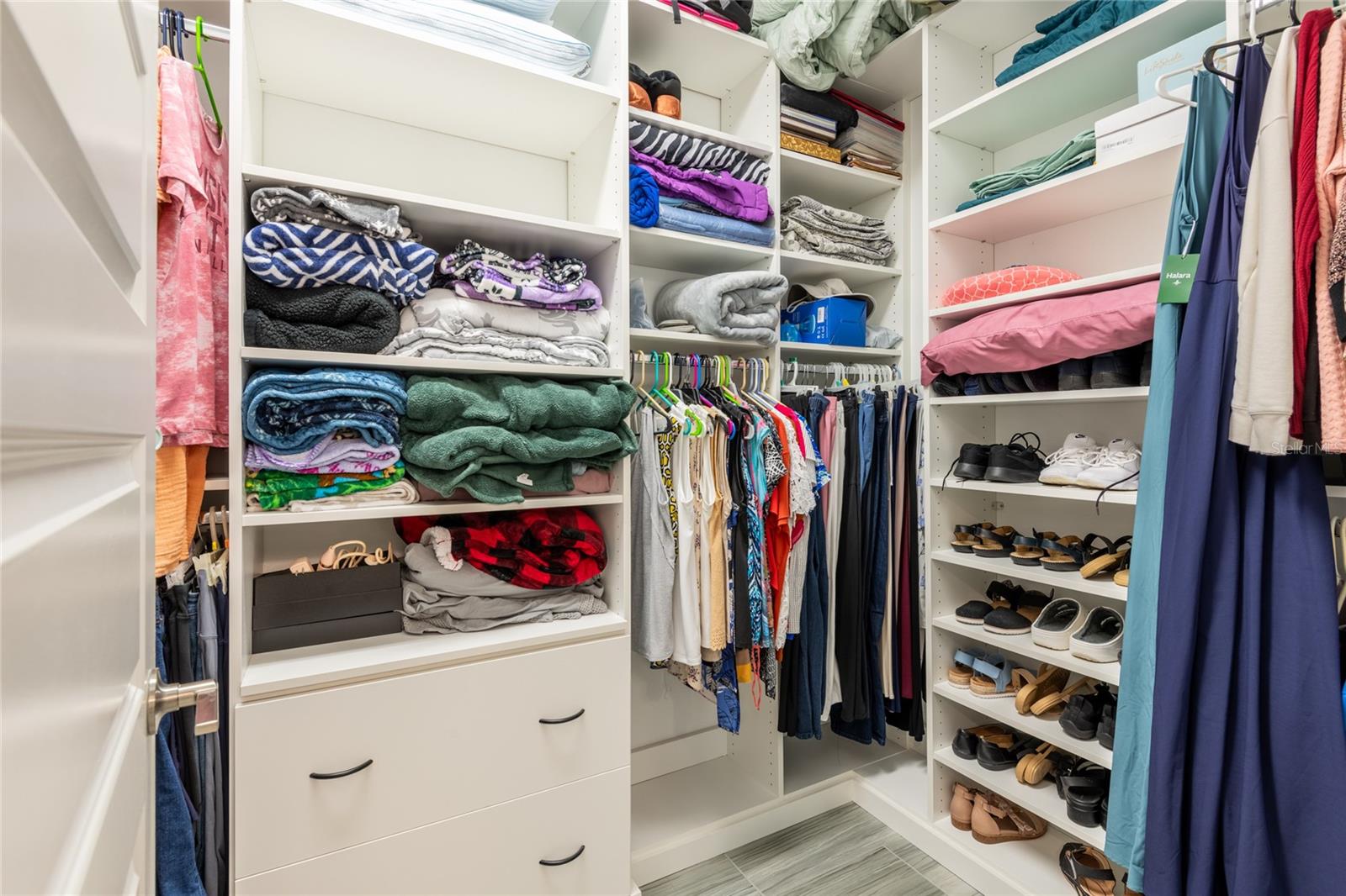 Primary bedroom custom closet by "Closet by Design"