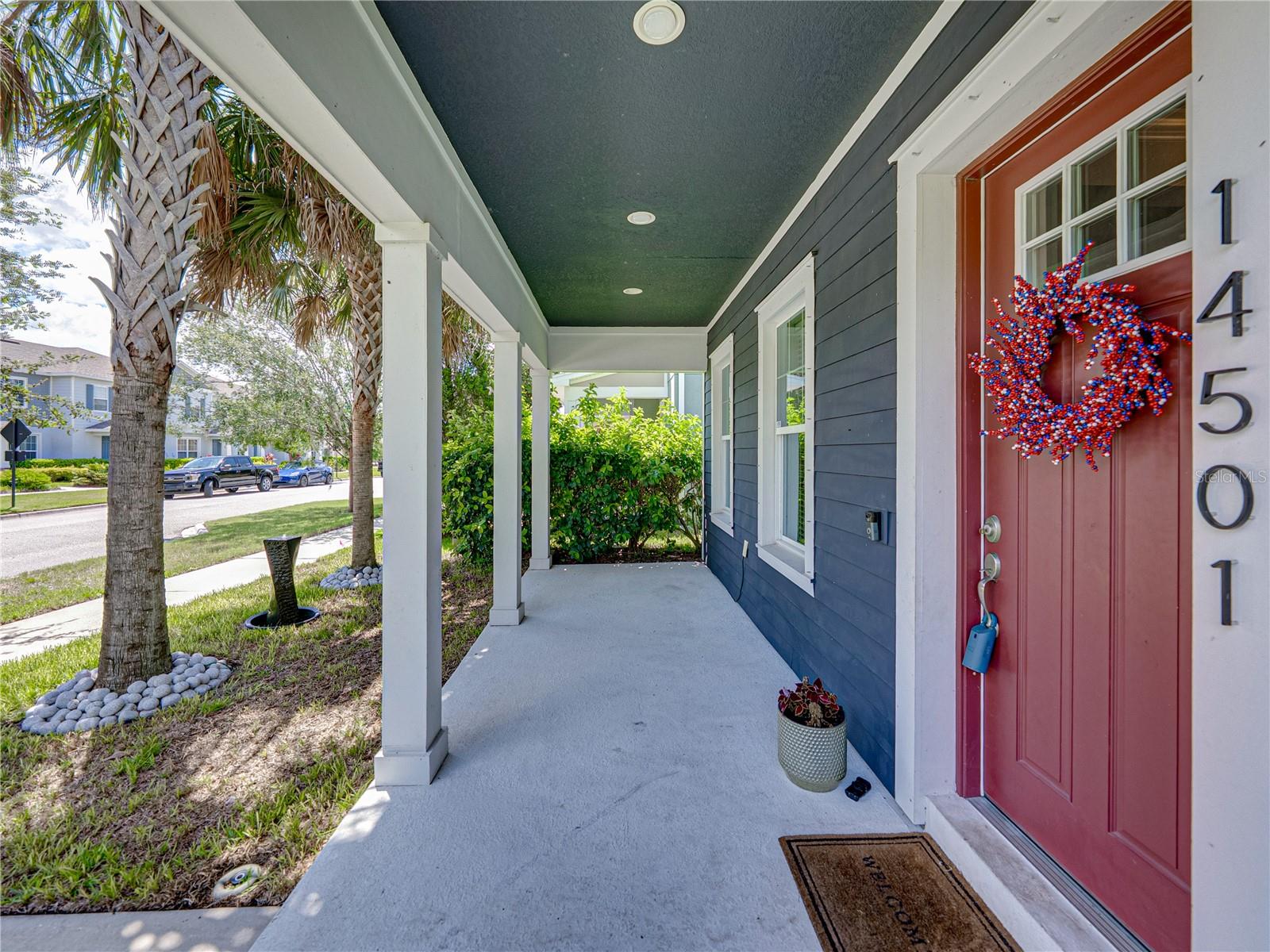 Spacious front porch is perfect for rocking chairs or a bench
