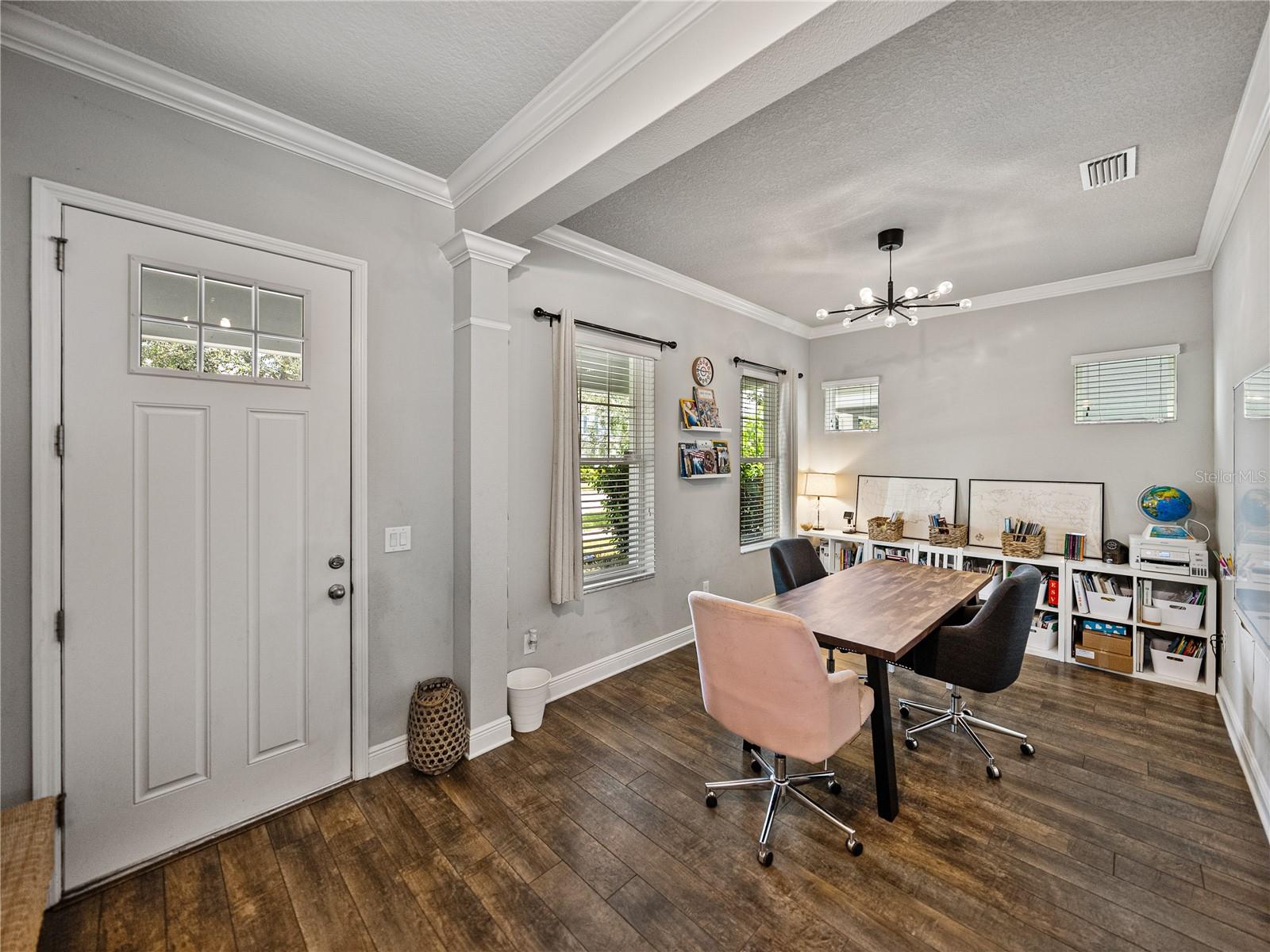 Foyer. The formal living room or dining room is currently being used for homeschooling