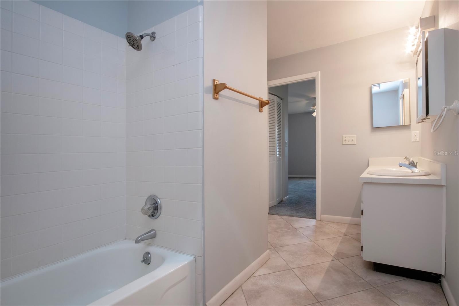 Primary bedroom has the shower/tub combo