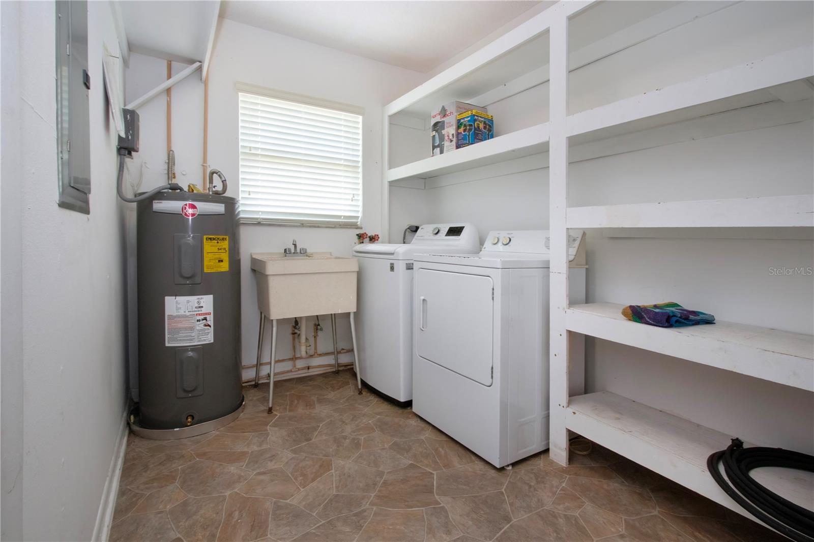 Utility room with 2020 water heater
