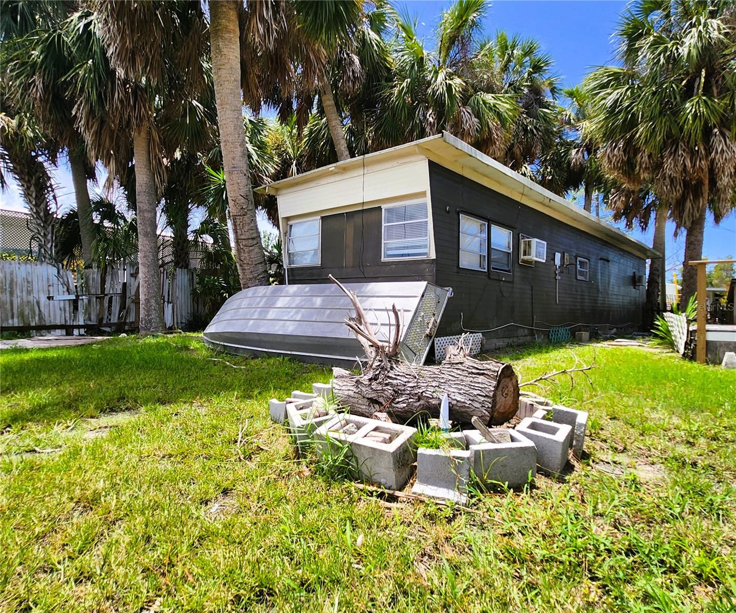 6977 Edgewater Dr.: Frontyard, dirt driveway, 1 bedroom, 1 bathroom MH, 410sf