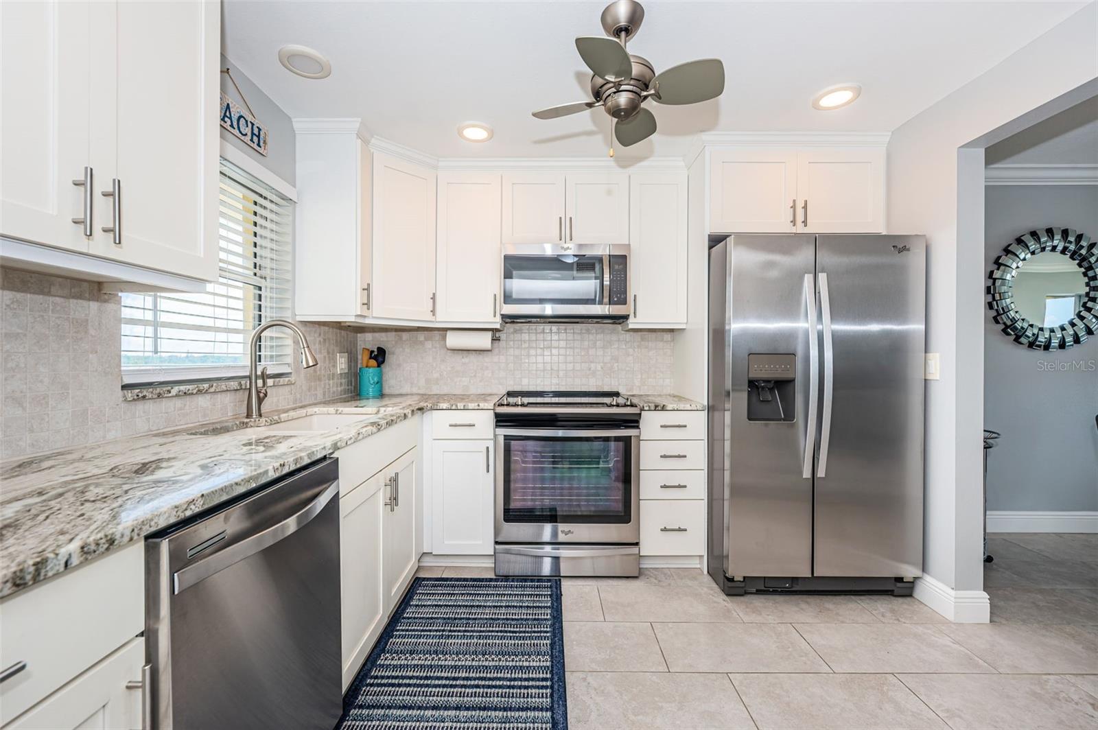 Kitchen with upgraded wood cabinets, granite counter tops and top of the line stainless steel appliances