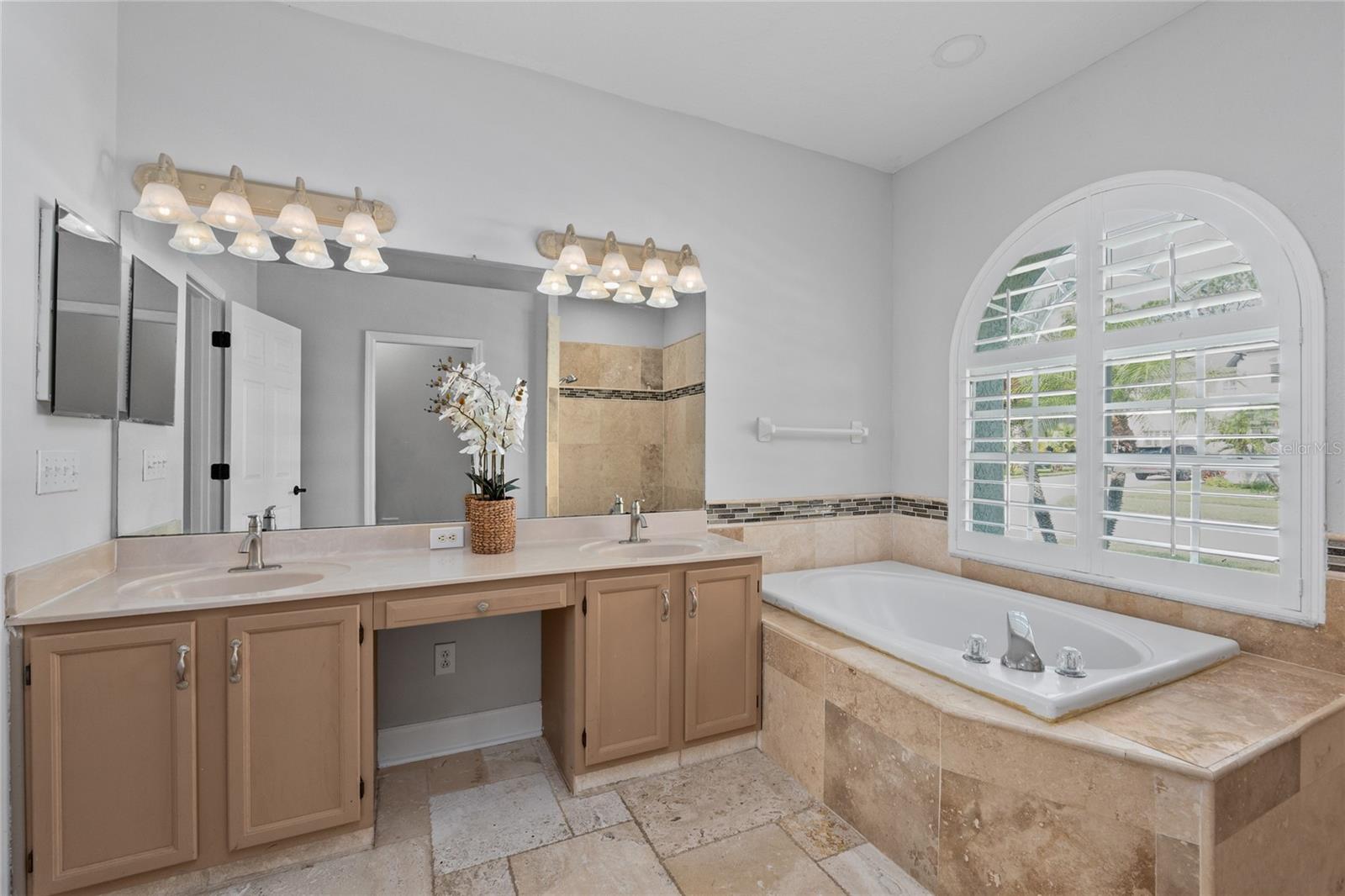 Primary Bathroom with dual sinks and tub