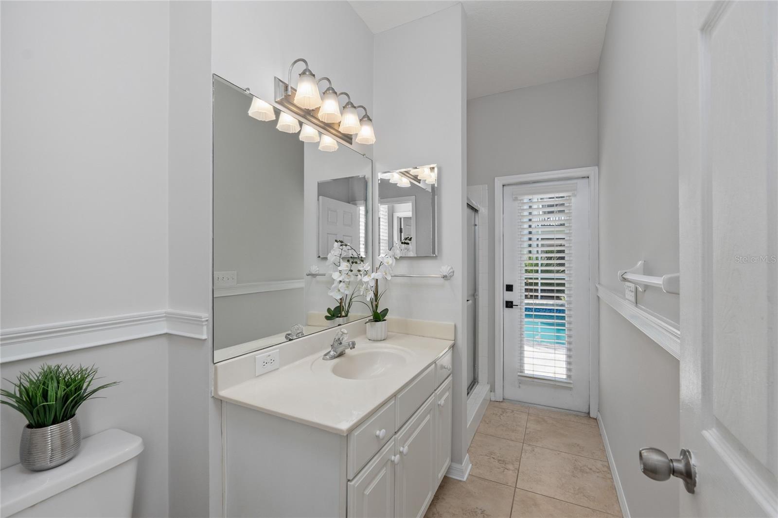 Bathroom 3/Pool Bath at rear of the home