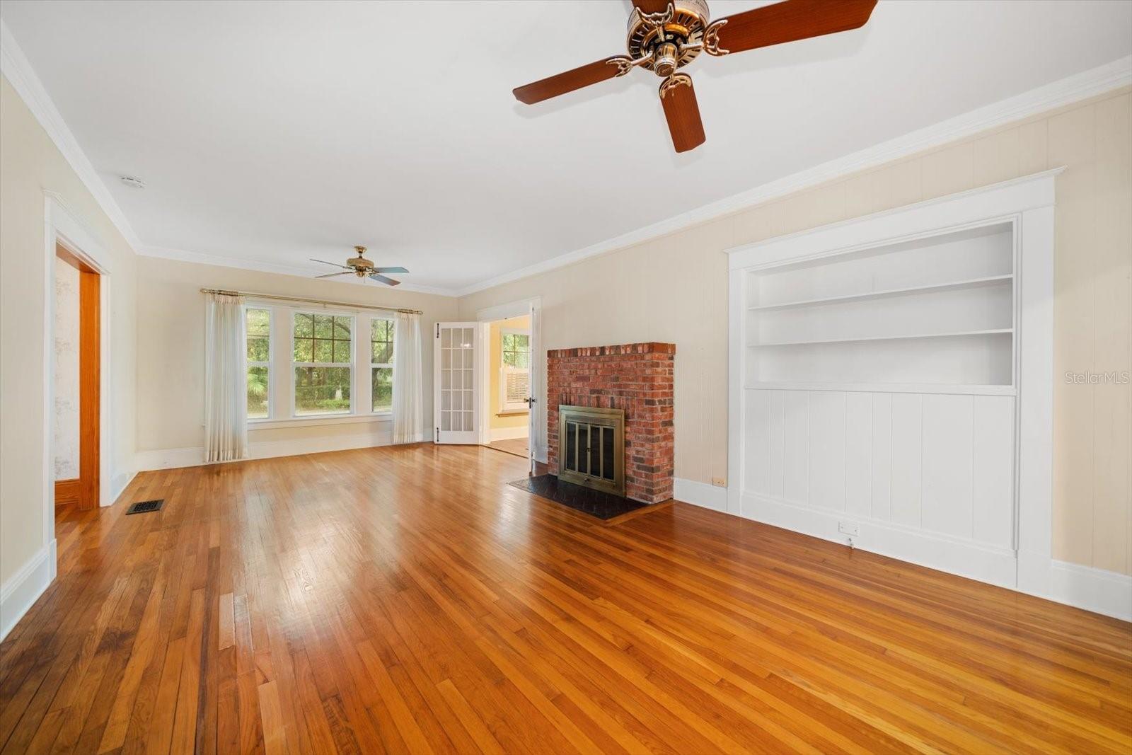 Large living room with fireplace/ office is off this room