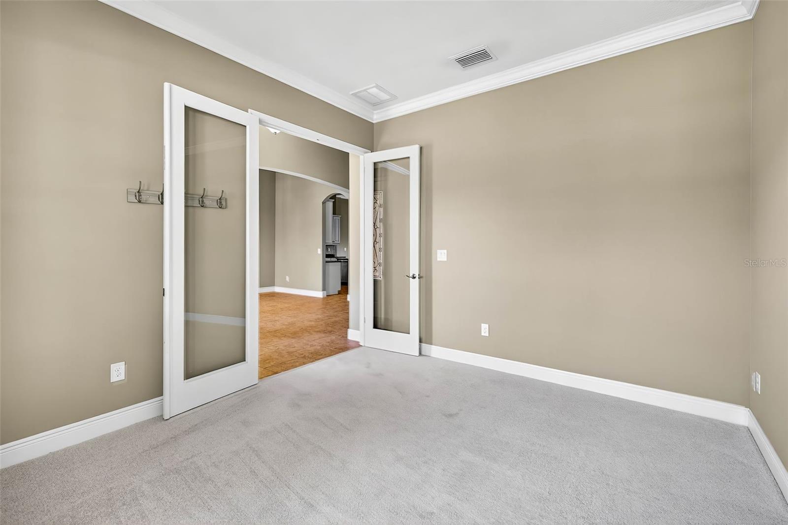 Front flex room with double door entry