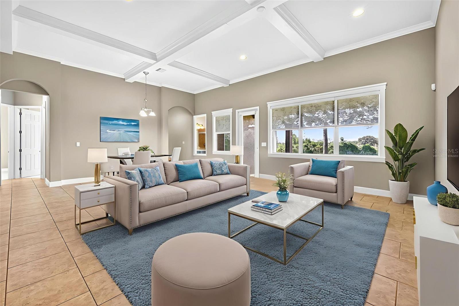 Virtually staged- great room with cross-tray ceiling