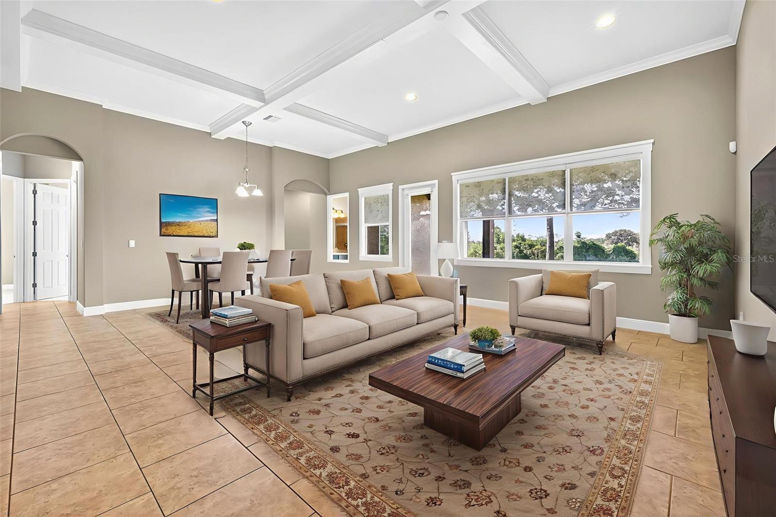 A truly "great" room with cross-tray ceiling sits in the center of the home.
