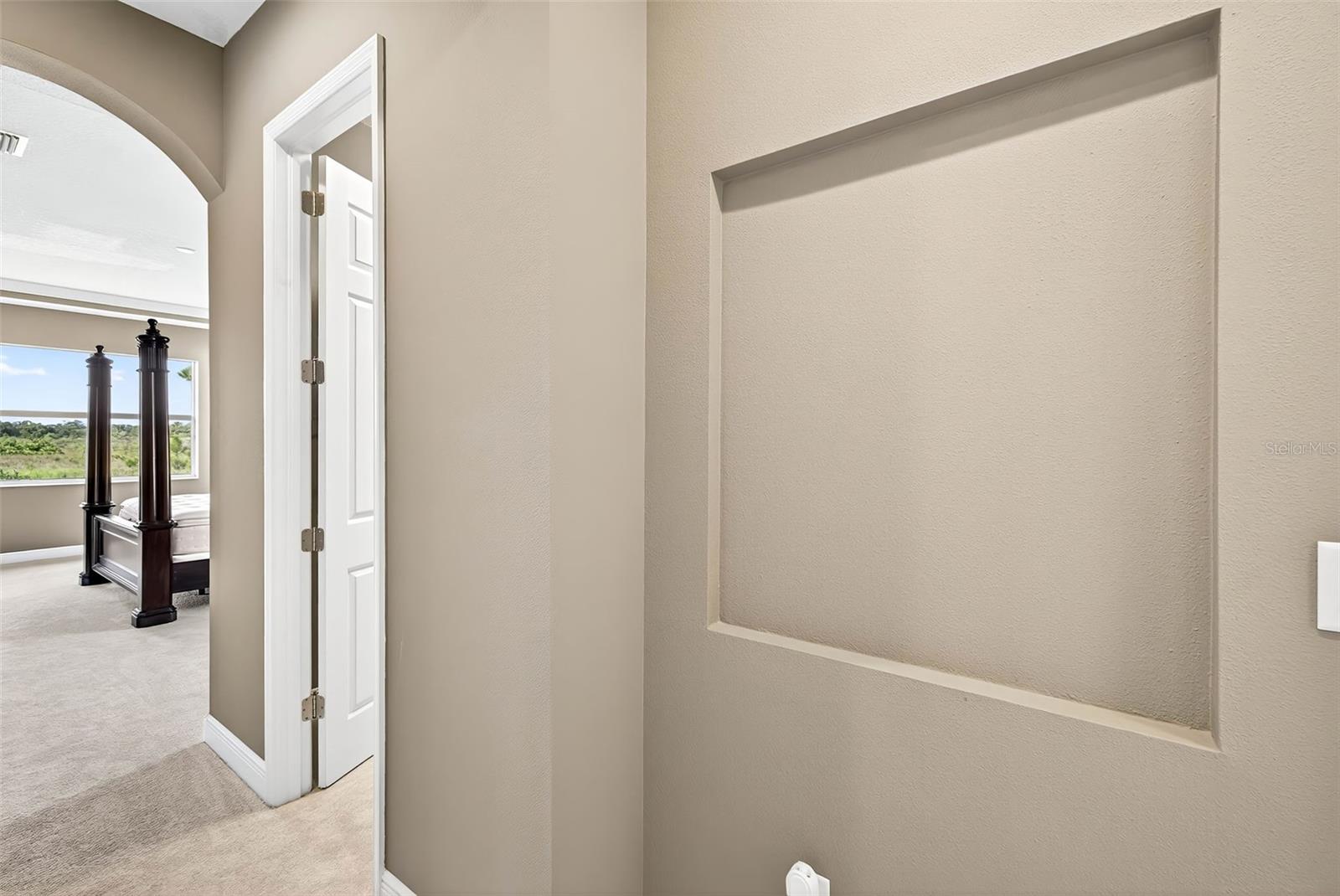 Entryway from primary to the ensuite bath