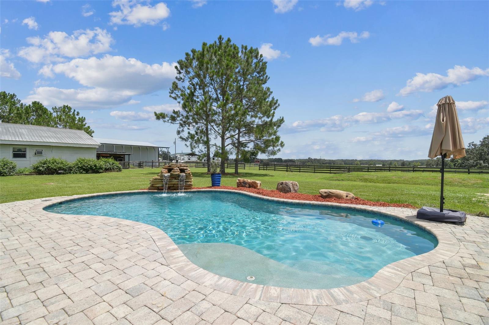 New custom Pebbletec pool with waterfall feature