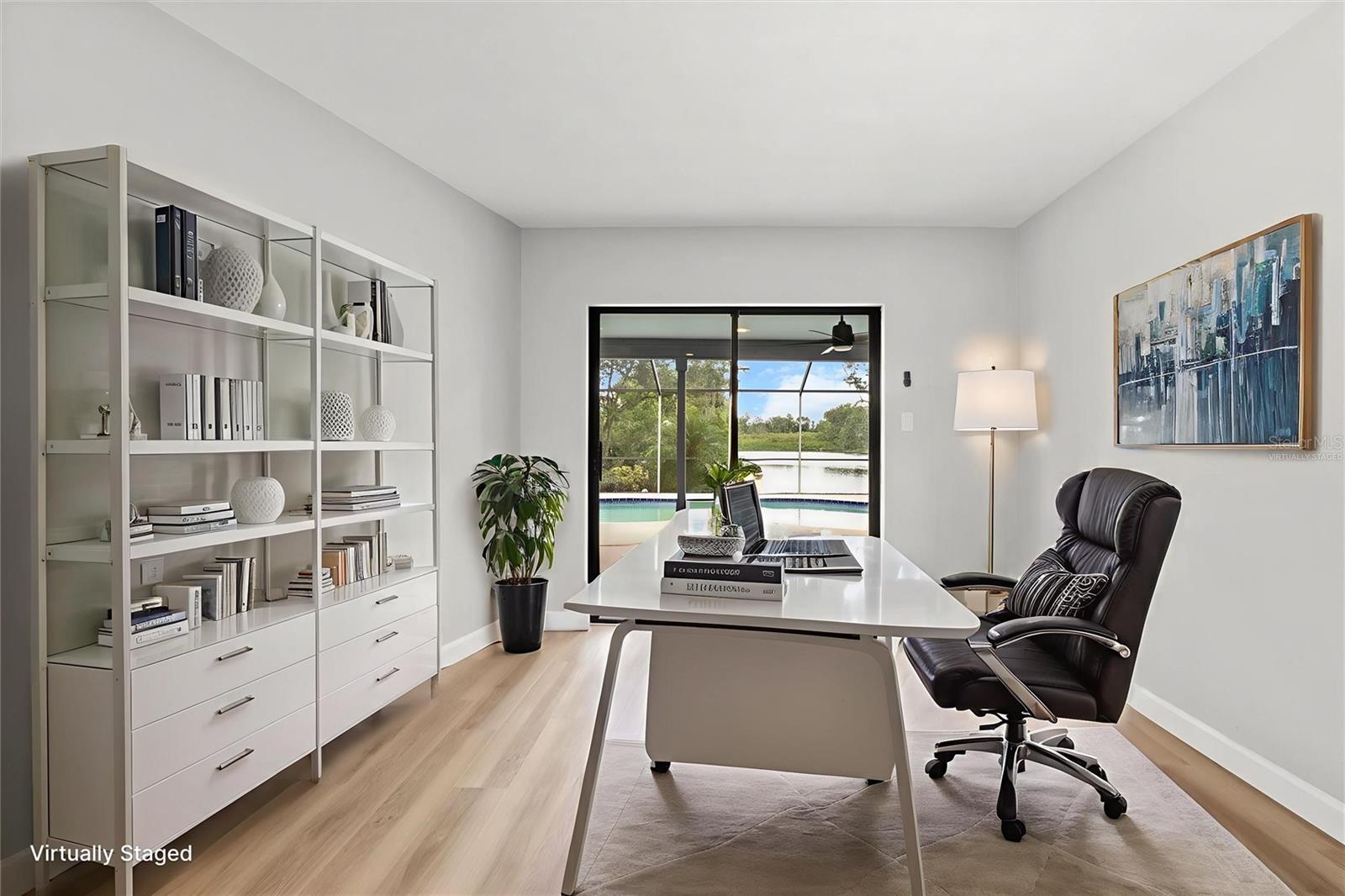 Virtually staged front living room as an office