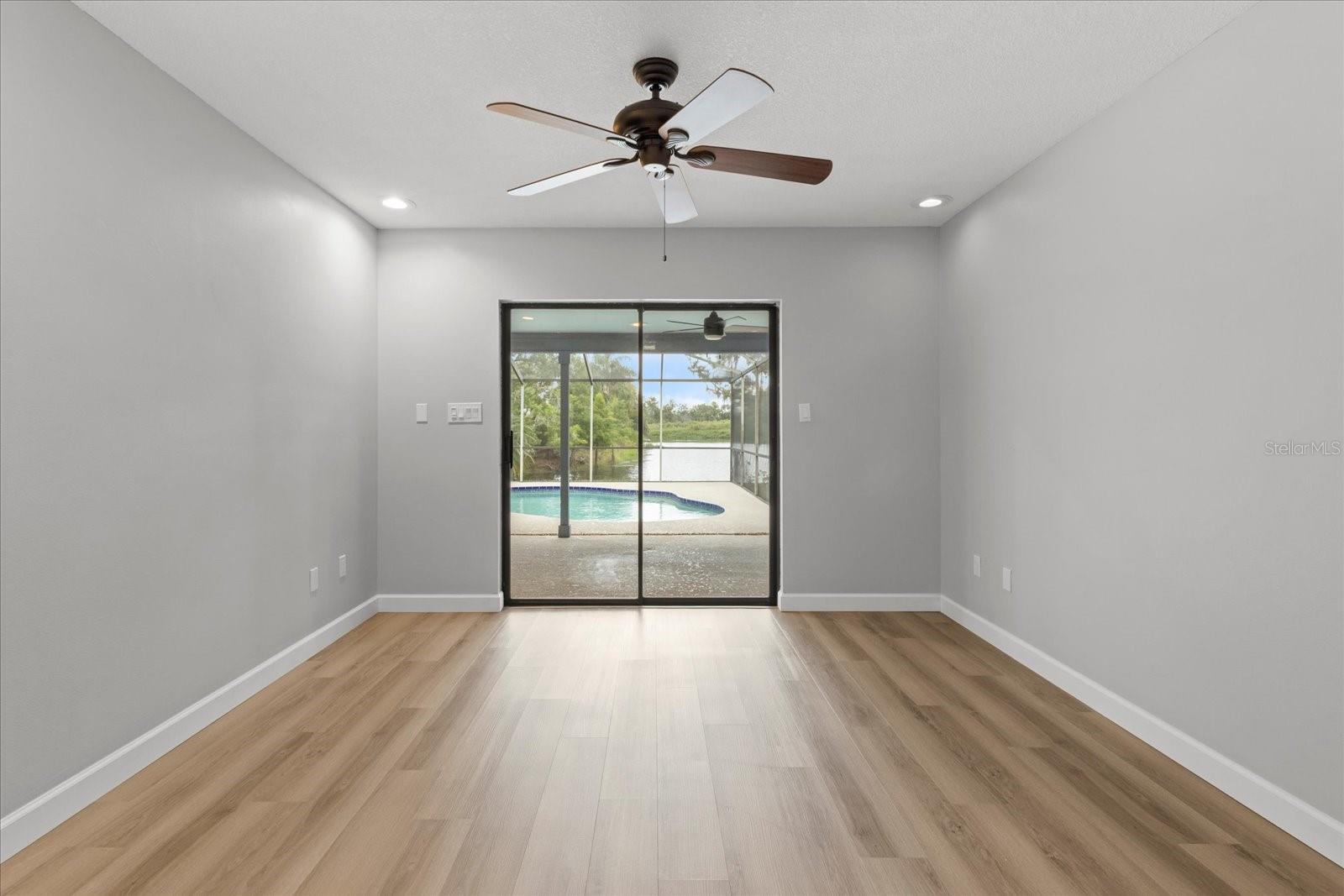 Master bedroom with pool and lake view