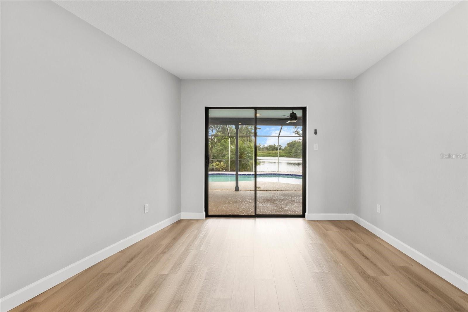 Front living room with view of pool