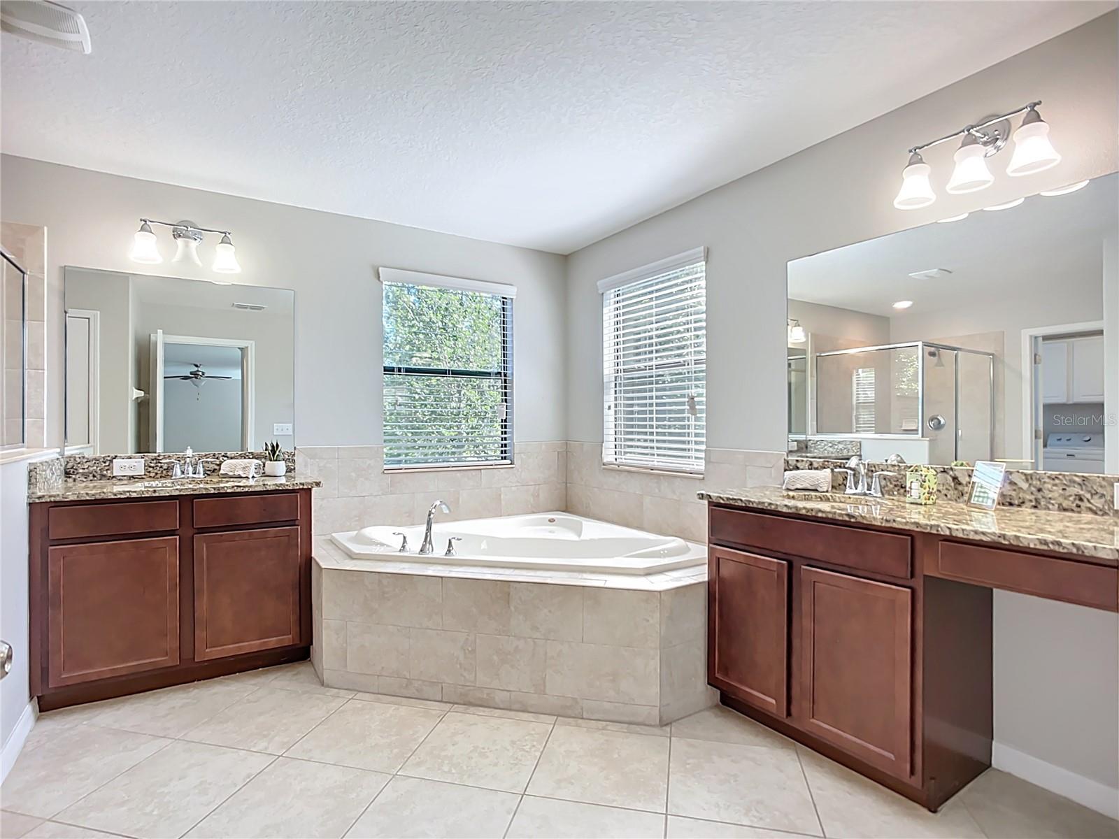 two vanities with garden tub and shower