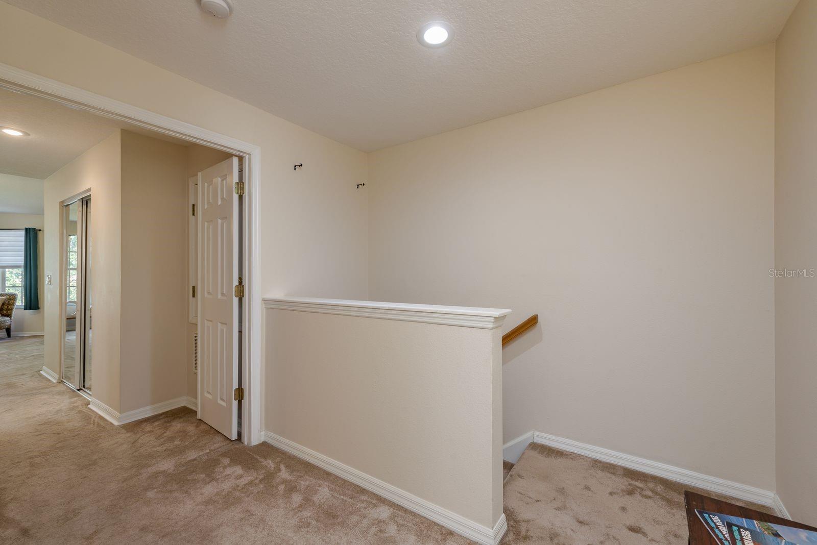 HALLWAY LEADING BACK DOWNSTAIRS
