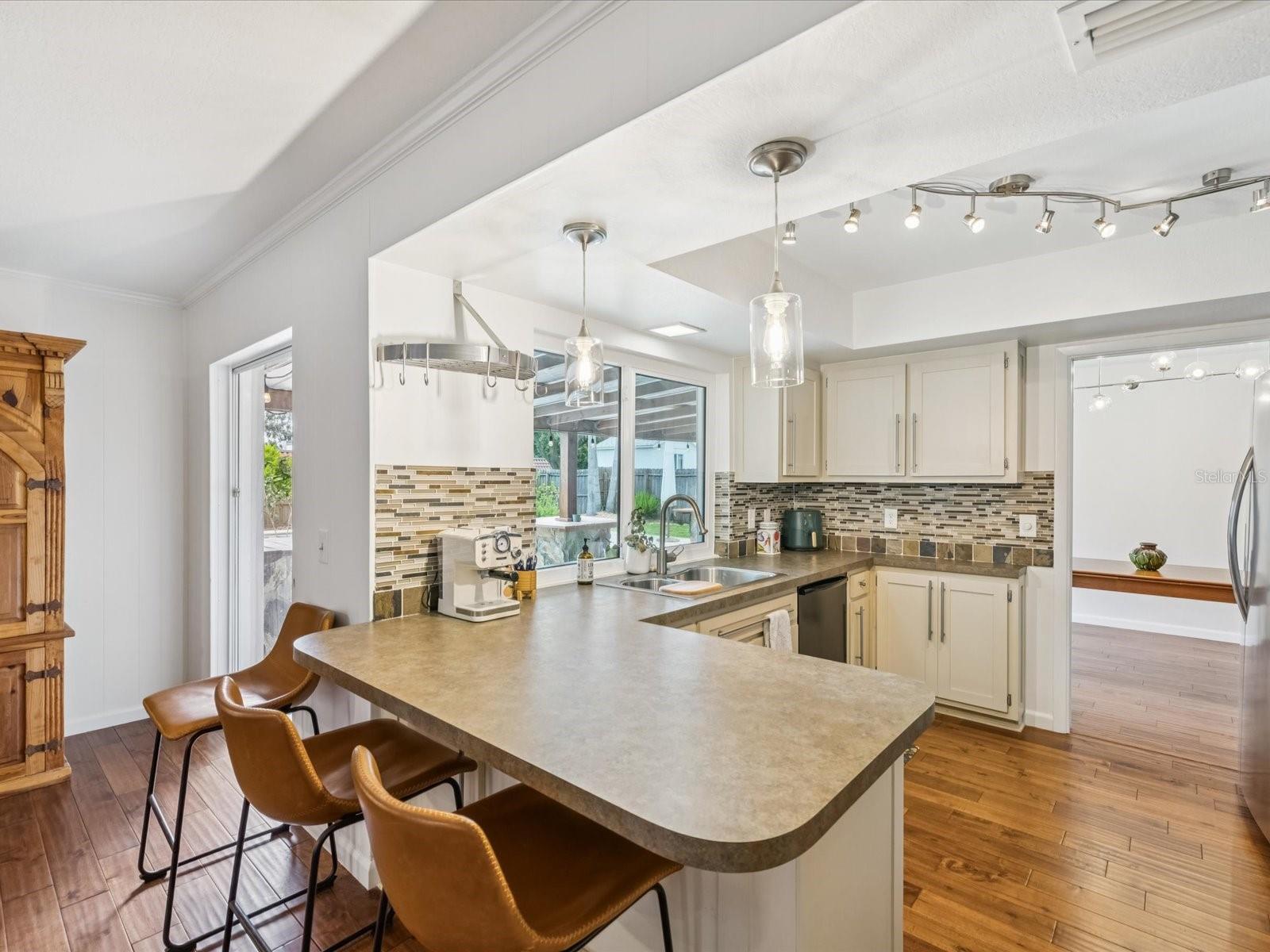View of Kitchen, Dining Room and Large Slider