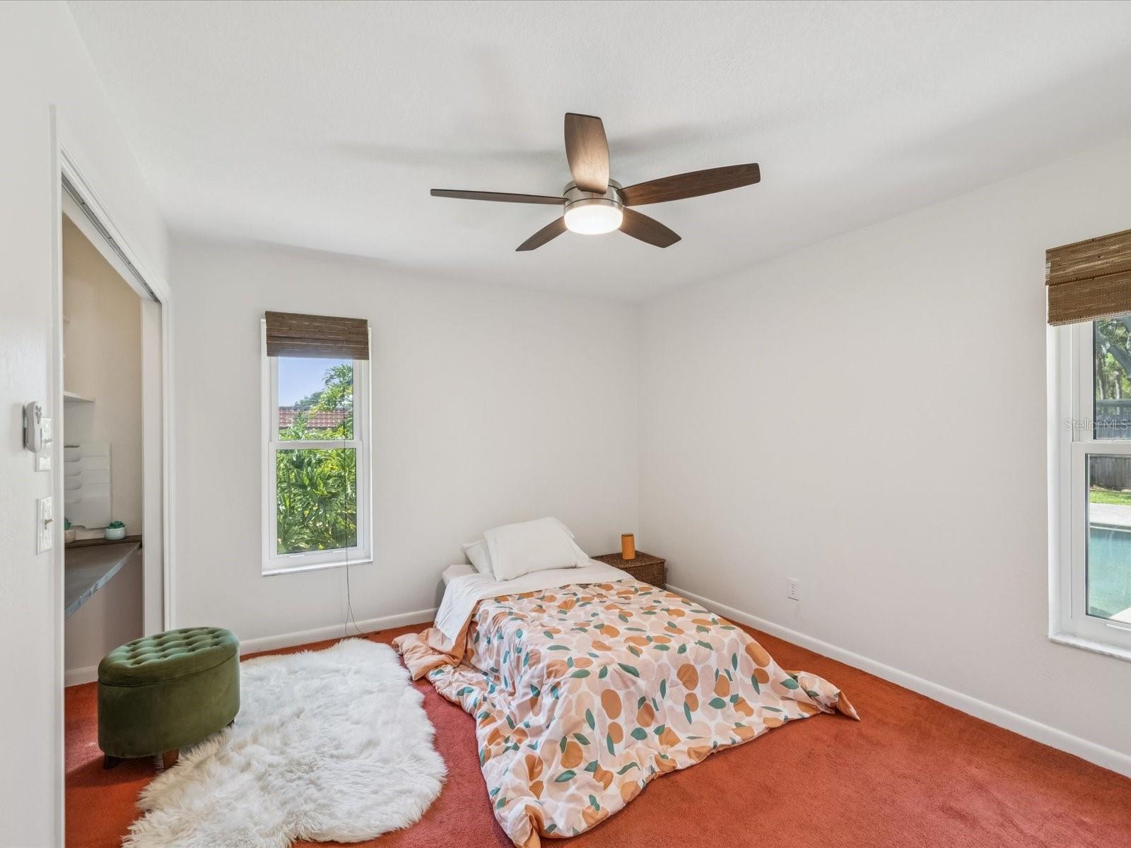 2nd Bedroom w/ Views of the Pool & Backyard