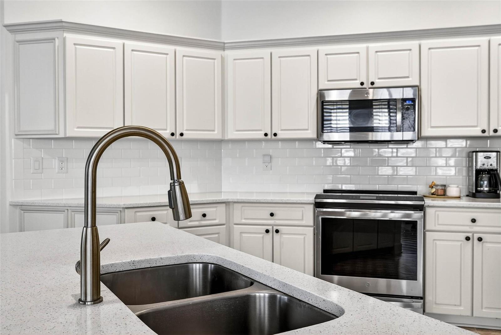 Quartz countertops and stainless appliances