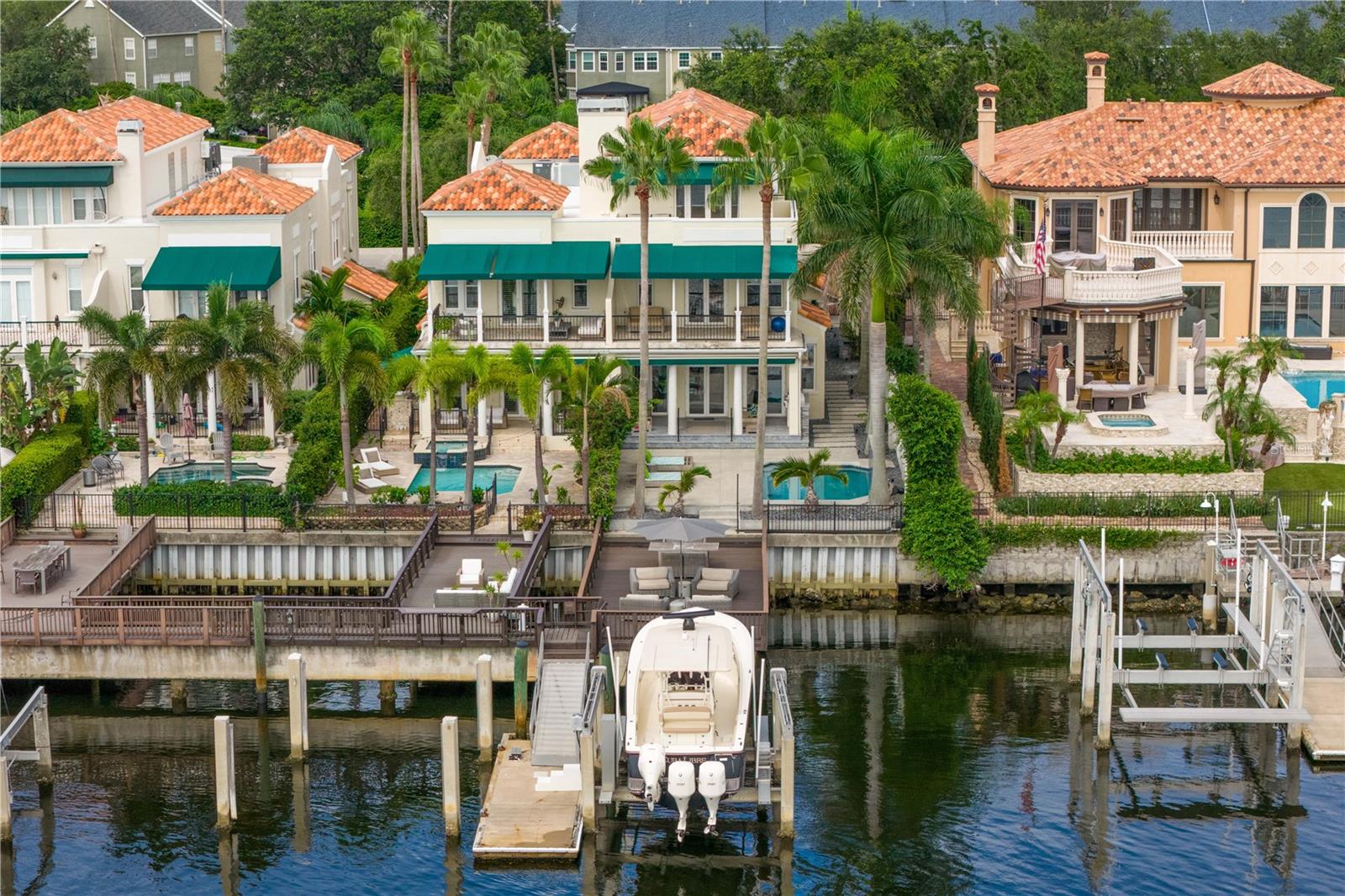 Welcome Home to this Stunning Waterfront oasis; truly a one-of-a-kind 3-story custom designed residence on outstanding water with easy access to the Bay and Gulf!