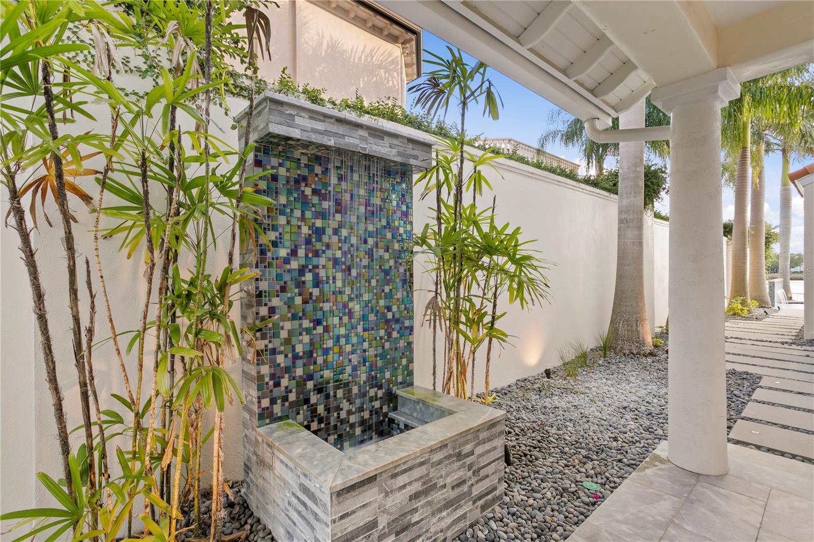 Sounds of this beautiful waterfall & fountain greet you at the front entrance to the home