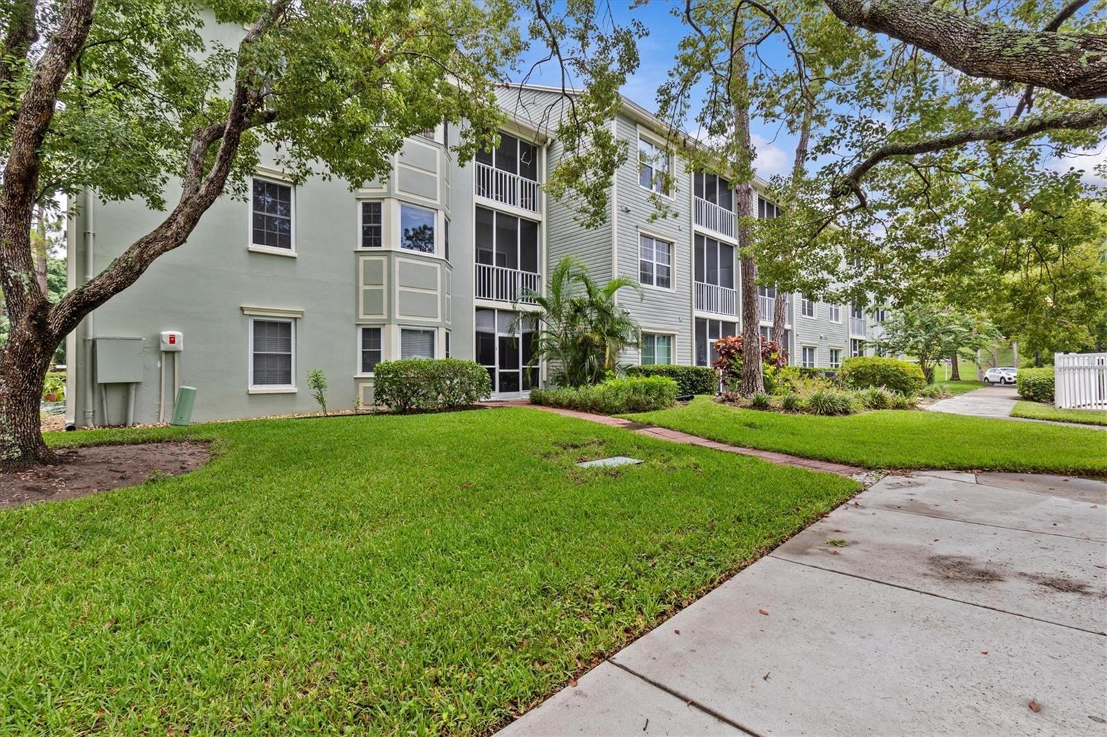 Looking to the balcony on the 2nd floor, overlooking the pool and well manicured grounds.