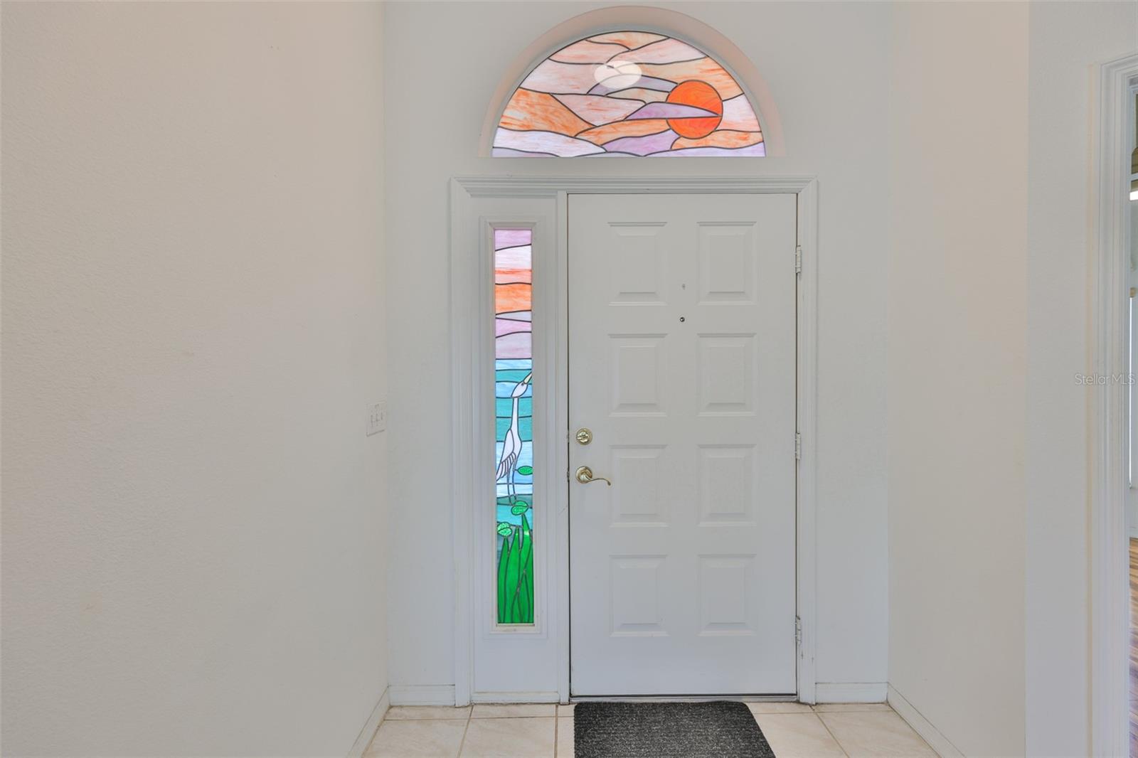 Your front door, screened entry, stained glass panels!
