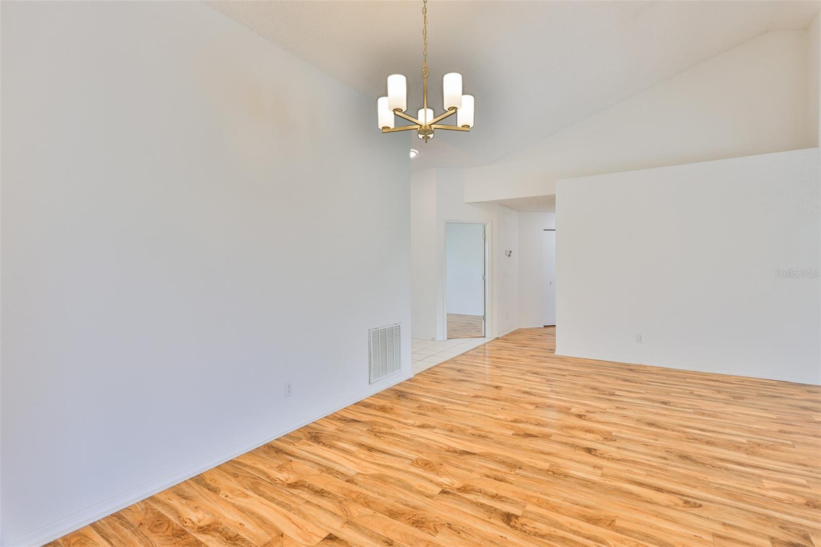 View from Dining Room to foyer on left, Study/Office in center and hallway.