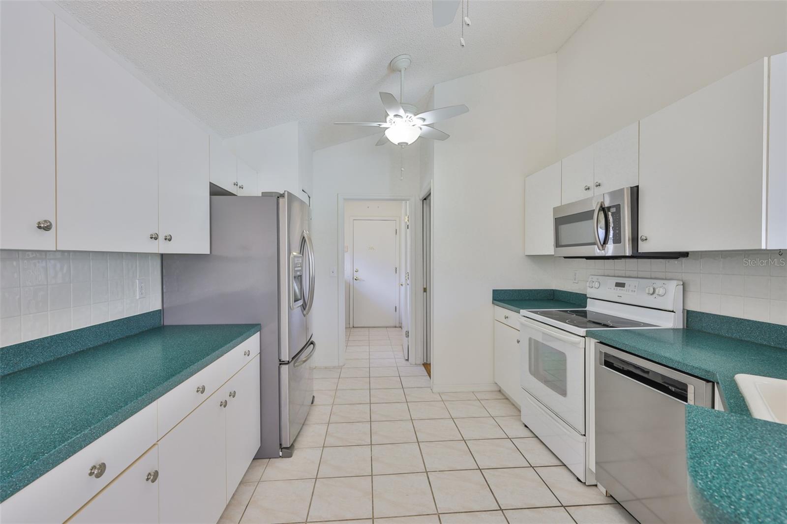 Counters, counters and counters! View to laundry room and garage.