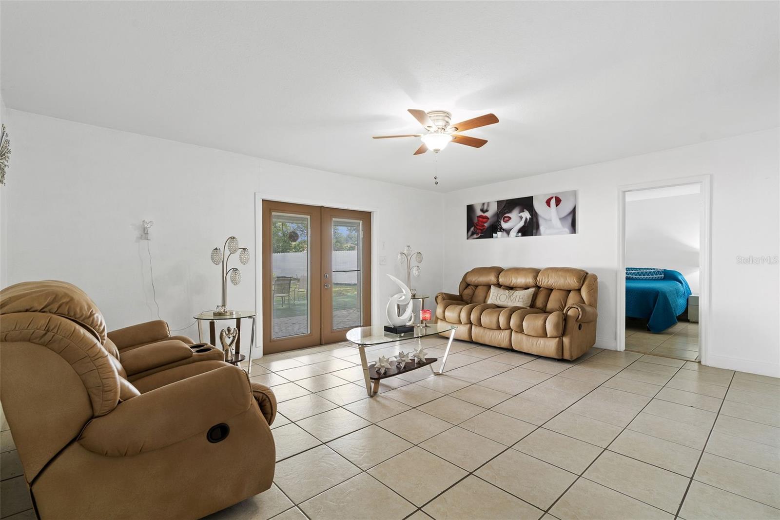 Family Room with French Doors that lead to outside porch area