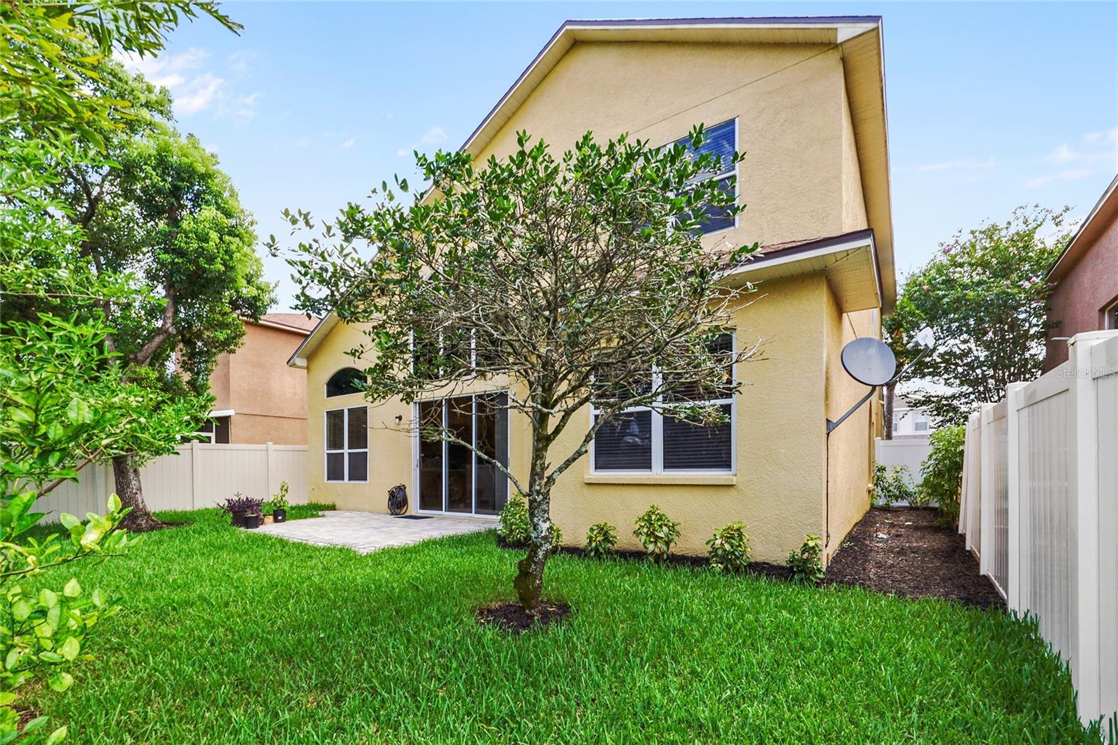 Fully fenced backyard and paved patio