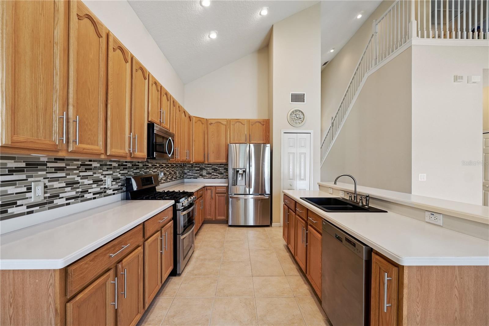 Kitchen with gas range, stainless steel appliances, and lots of cabinet and counter space.