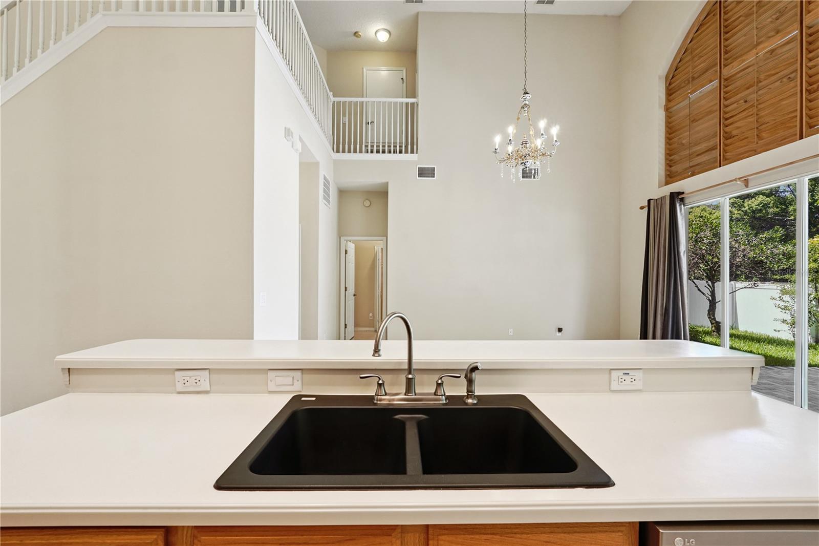 Corian countertops with deep kitchen sink.