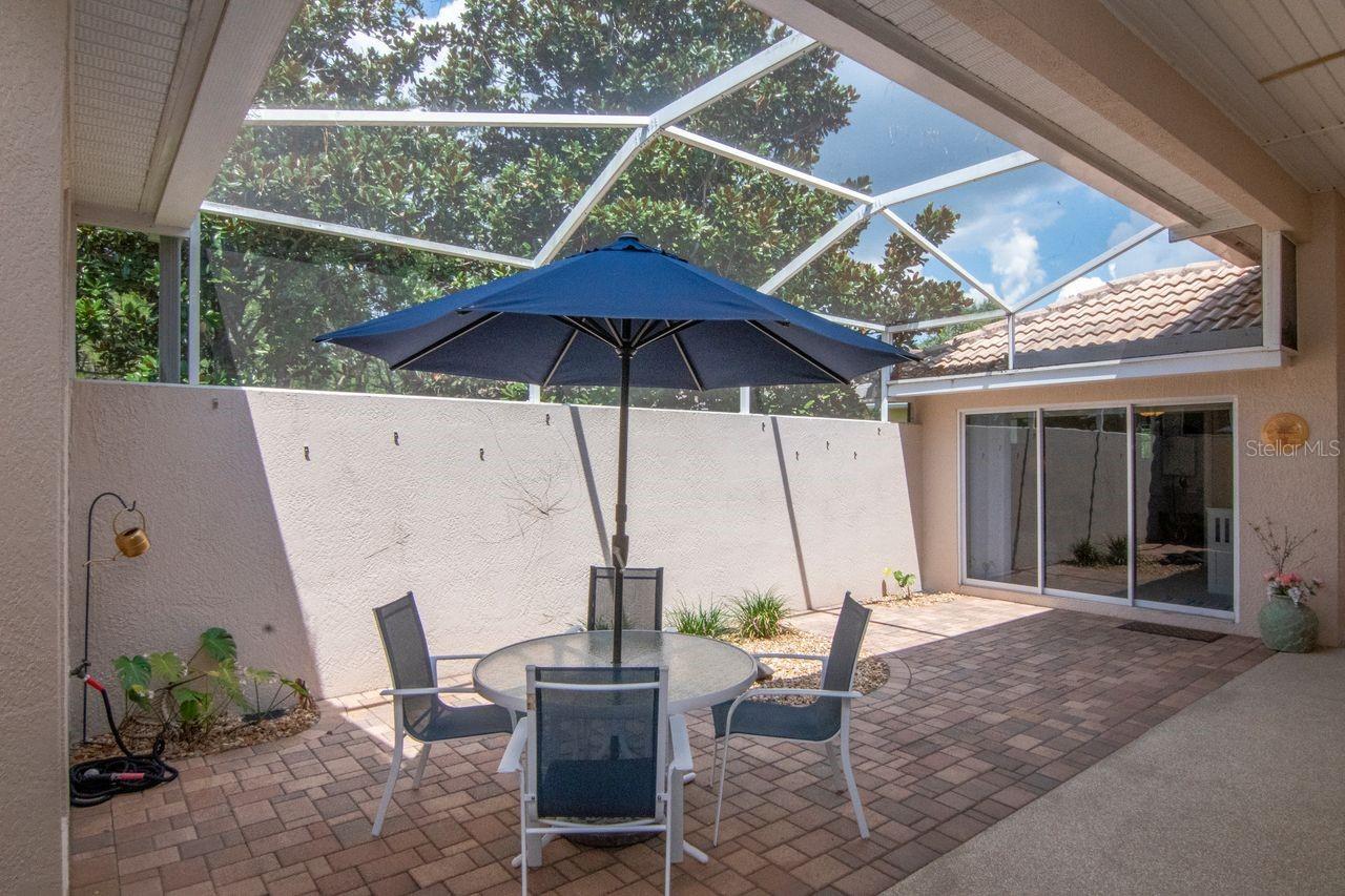 Courtyard view of entry to private entry bedroom