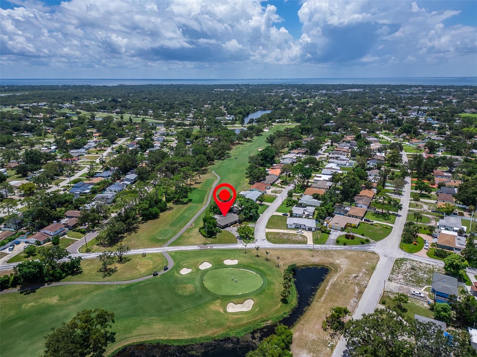 Nestled on an oversized corner lot backing onto a top-rated 18 hole course