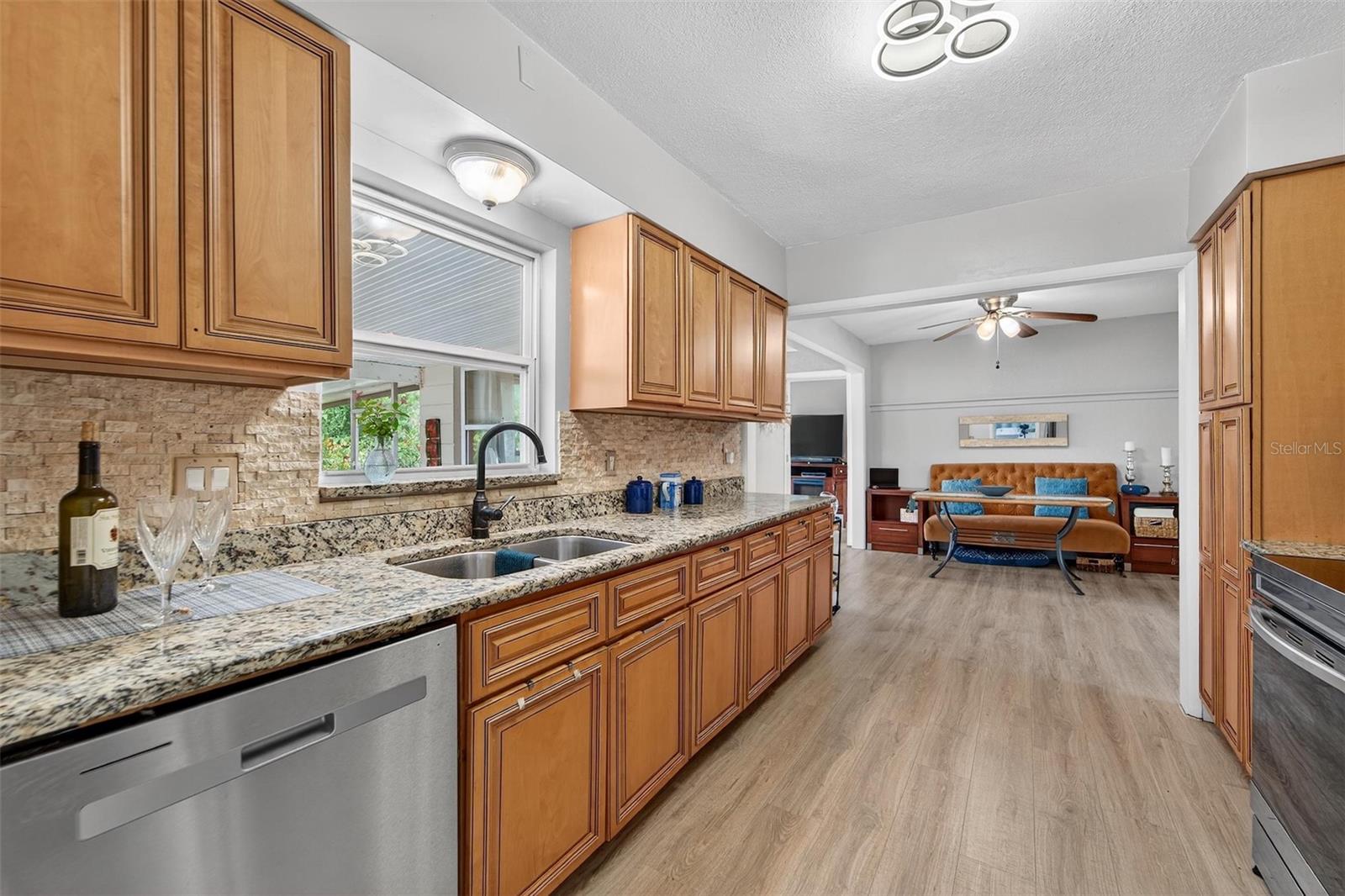 Window over the sink provides natural light and a charming view of the backyard