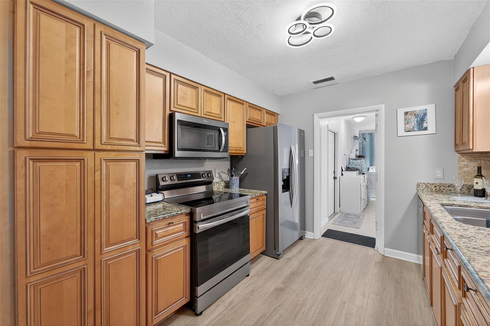 Includes full-size stainless appliances_ refrigerator, range, microwave, and dishwasher