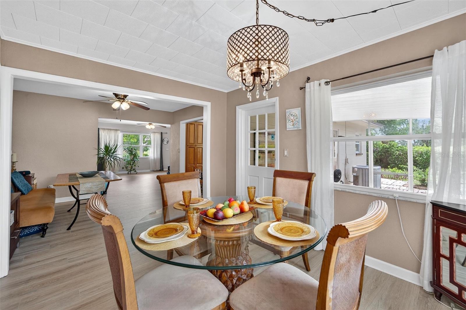 Spacious dining room with natural light and designed for both casual meals and formal gatherings