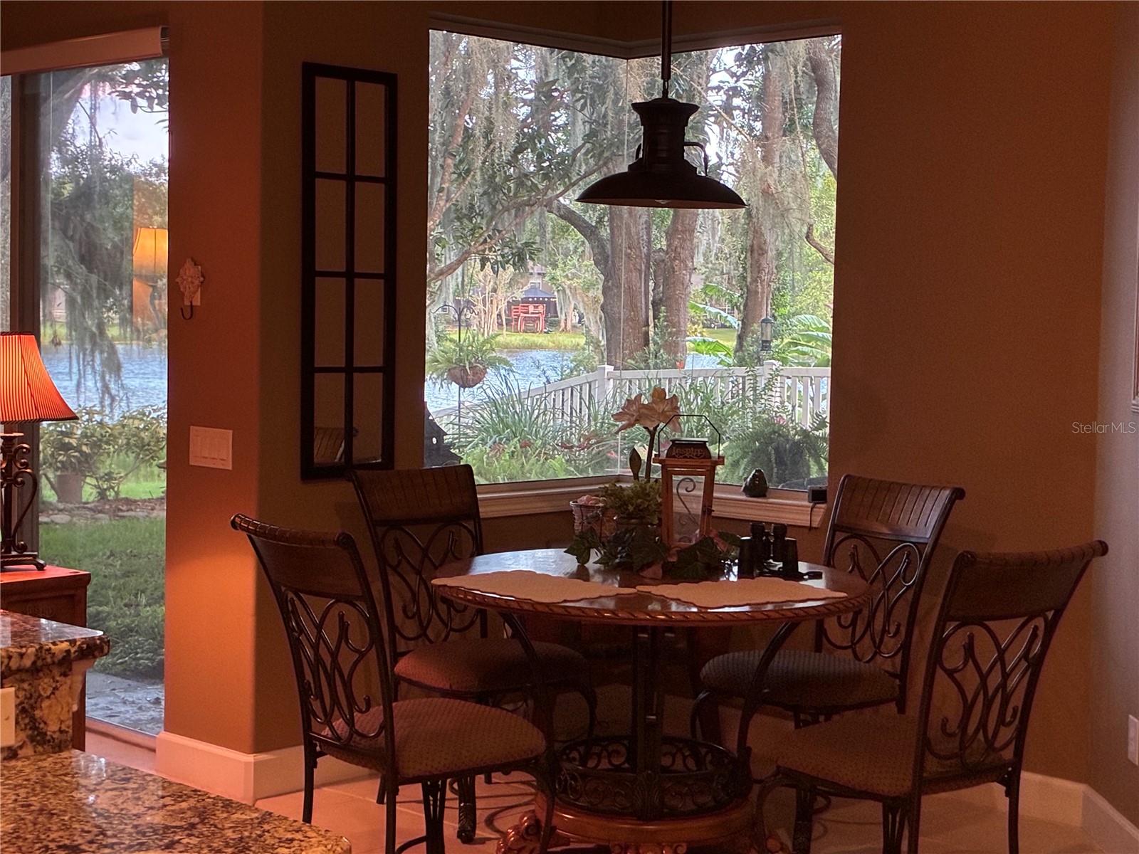 Breakfast nook at sunset with view of lake