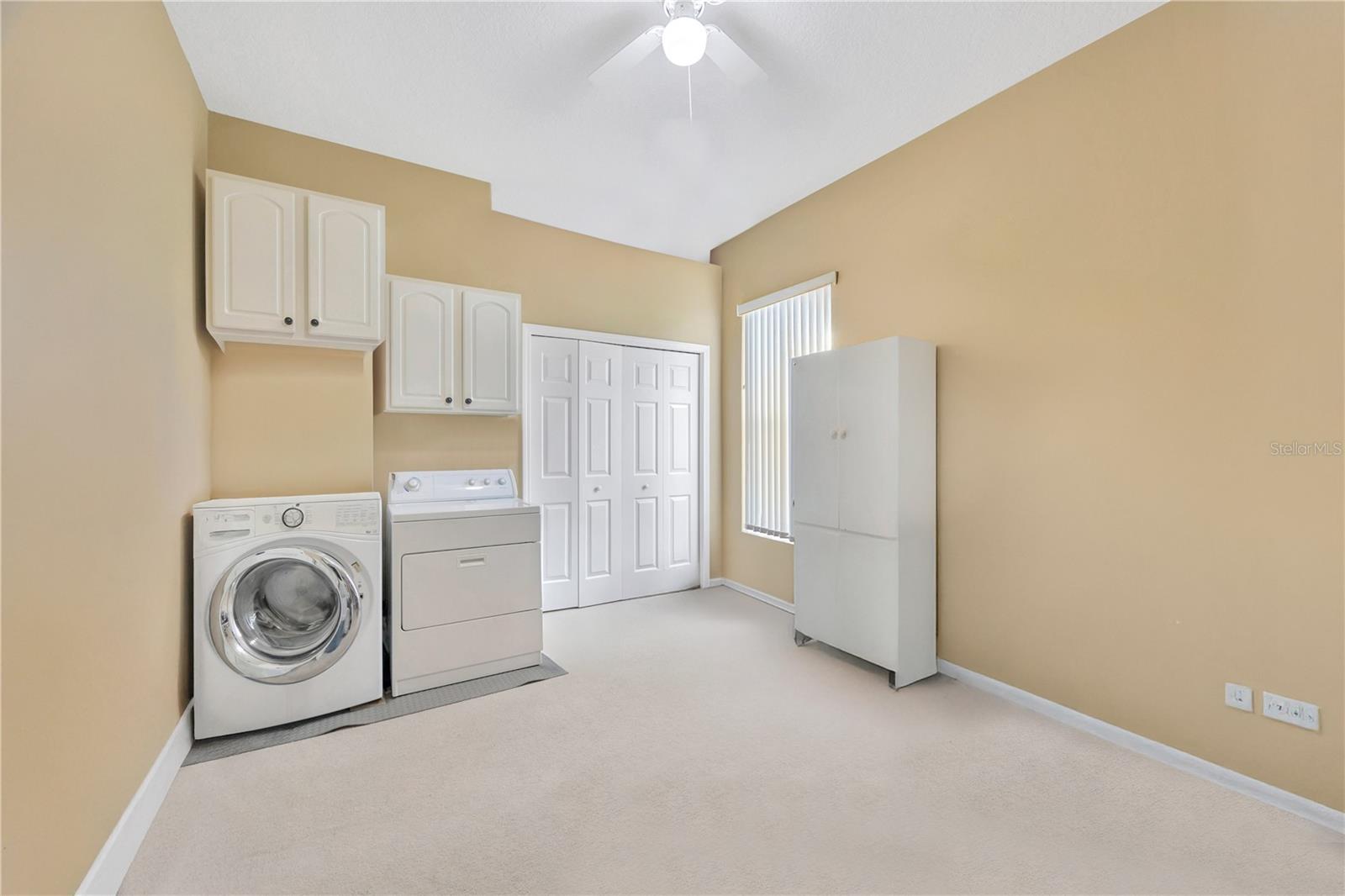 Bedroom 2, currently used as laundry room/crafts room