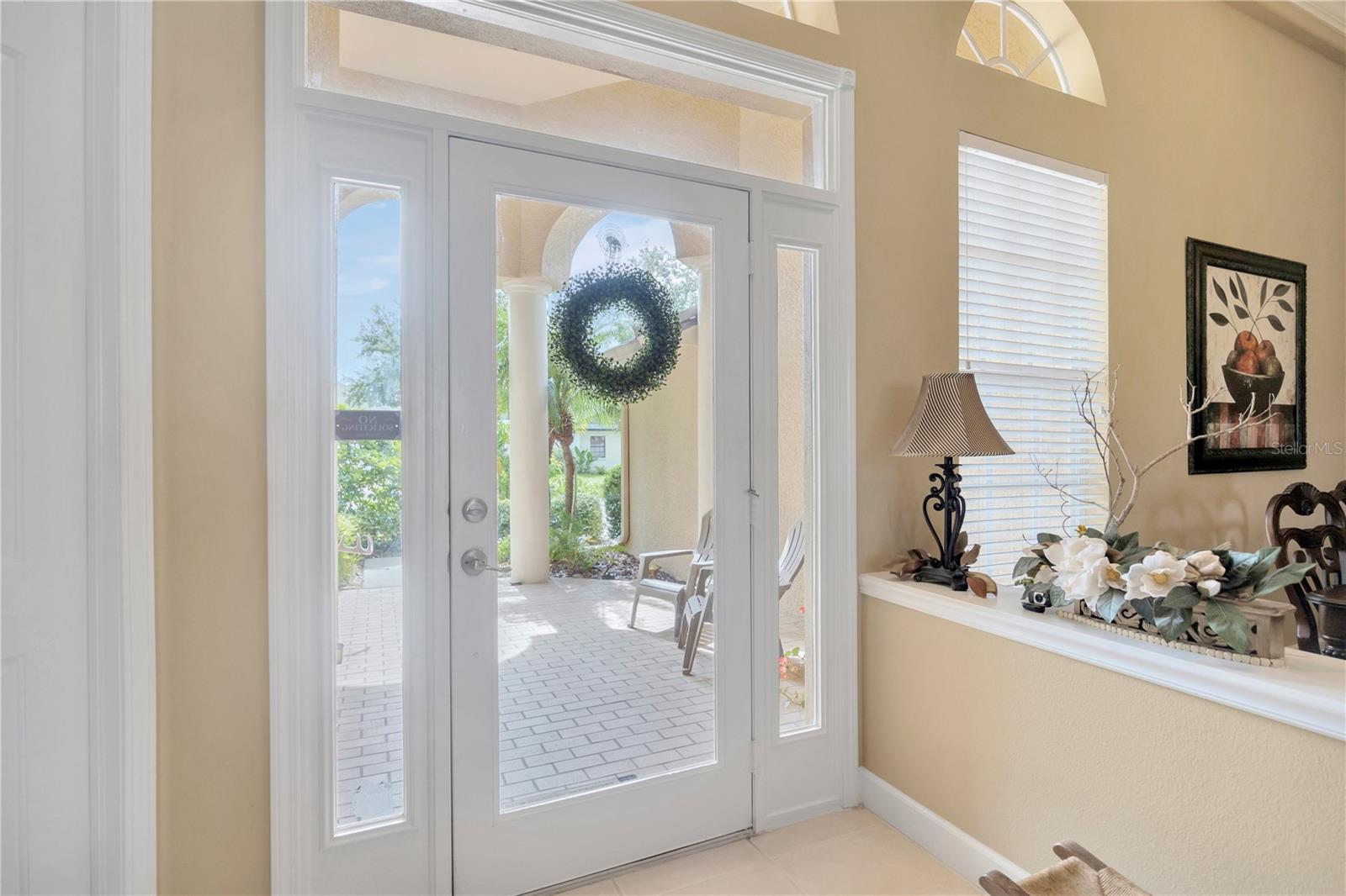Entry, dining room to right