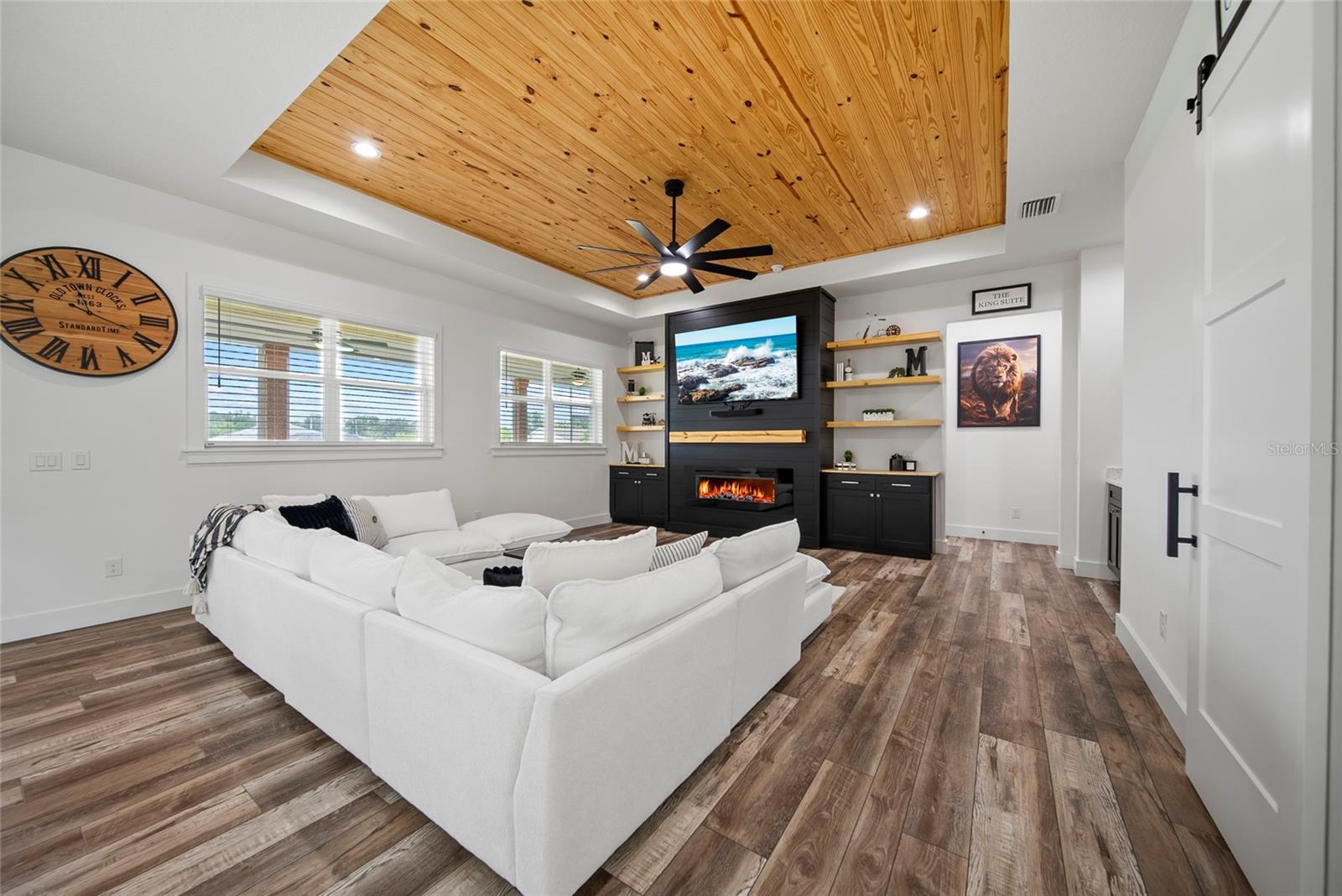 living room with custom electric fireplace mantle